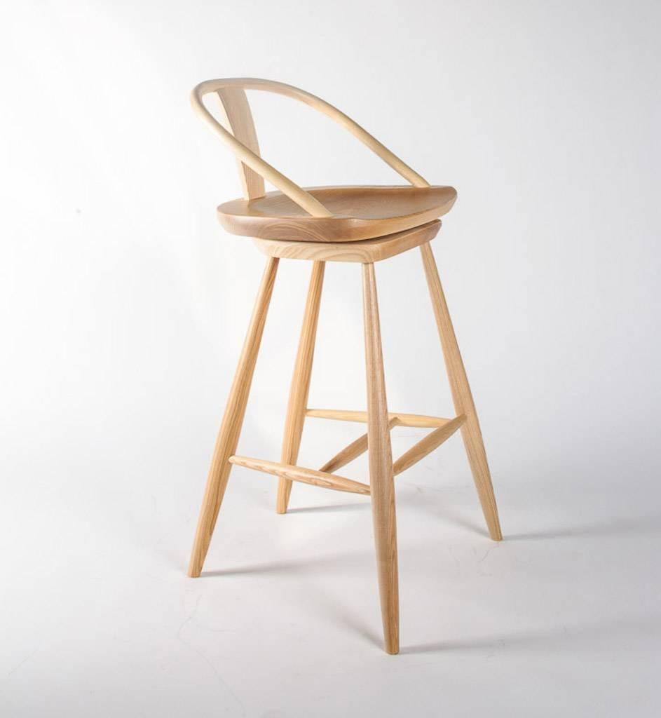 Solid ash barstool in natural finish is bench made in Great Britain.