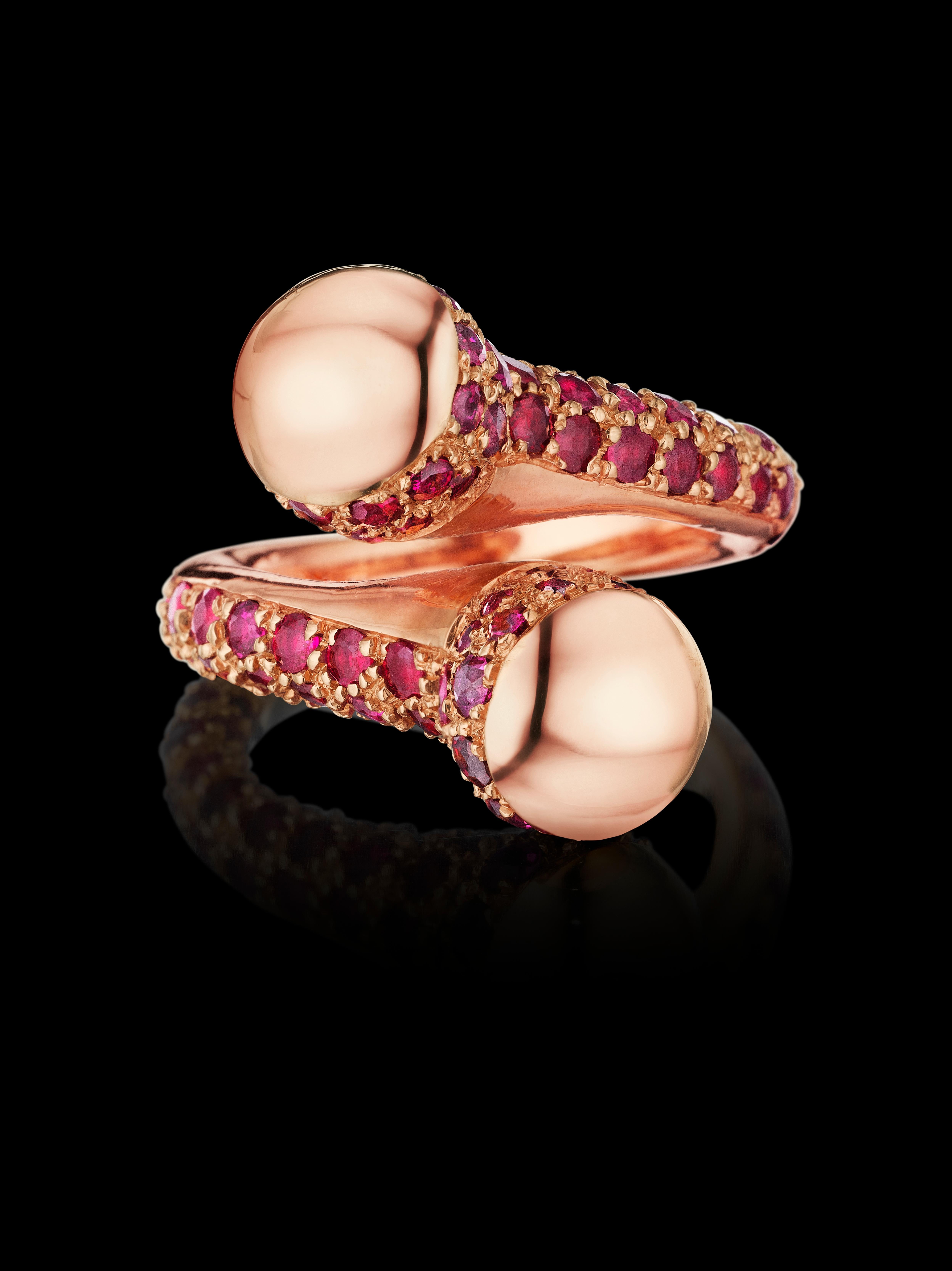 Limited-Edition Ring features Red Purplish Rubies - a cross over ring that is bold, daring and feminine, covered with sparkling pave set melee rubies, ring is set in 18k Rose gold. 

Size 7.25 

Gemstones:  100 Red purplish natural round-cut Rubies,