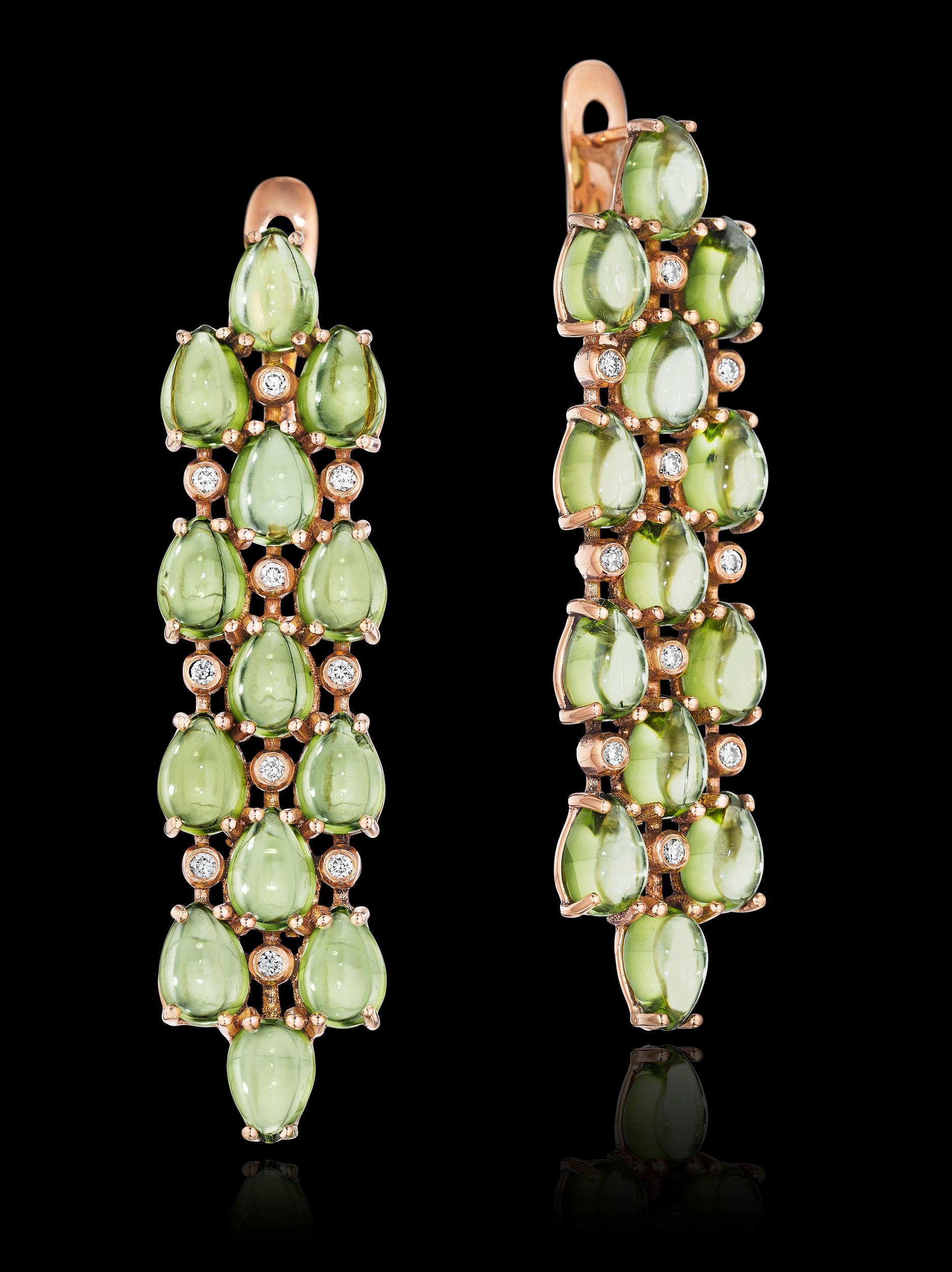 Limited Edition YOKI design, features 26, approx. 26.9cts 5x7mm Cabochon Pear Shaped Peridot. Total Diamond weight is approx. 0.3cts. Earrings are set on 18 karat Rose gold. Earring measures approx. 1.2cm face width across and 5.1cm face length.