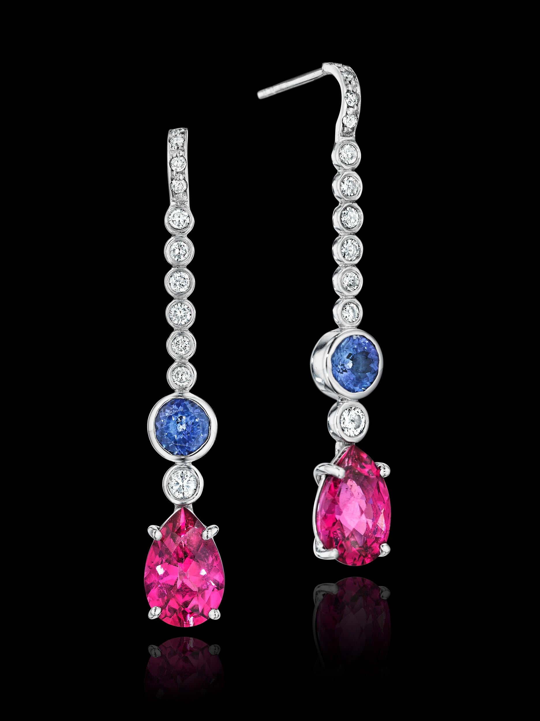 One-of-a-kind YOKI design, features Pink Tourmaline, Tanzanite and Diamond Drop Earrings. 

Earrings are set on 18 karat white gold, 

Gemstones: 2 Tourmalines, 8.12 x 12mm, 3.0 cts., 2 Tanzanites, 5.78-5.86mm, 1.5cts. and  22 diamonds 0.7cts