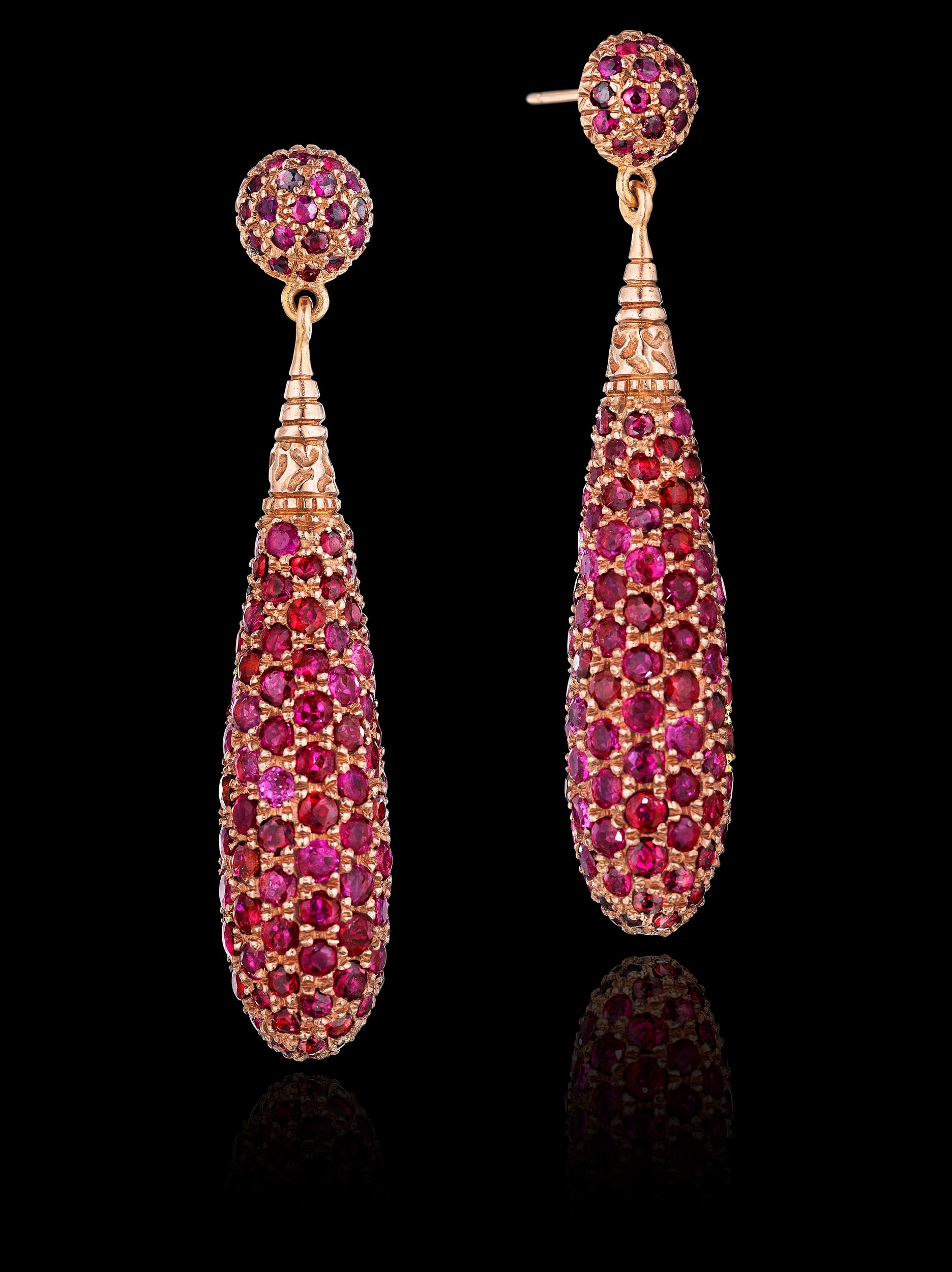 Limited Edition YOKI design, a pair of Ruby Drop pendant Earrings set in 18 Karat rose gold with a dazzling effect of pave set rubies in a three-dimensional elongated teardrop dangling from the ear.

Gemstones: Rubies

Piece Dimensions: 5.2cm face