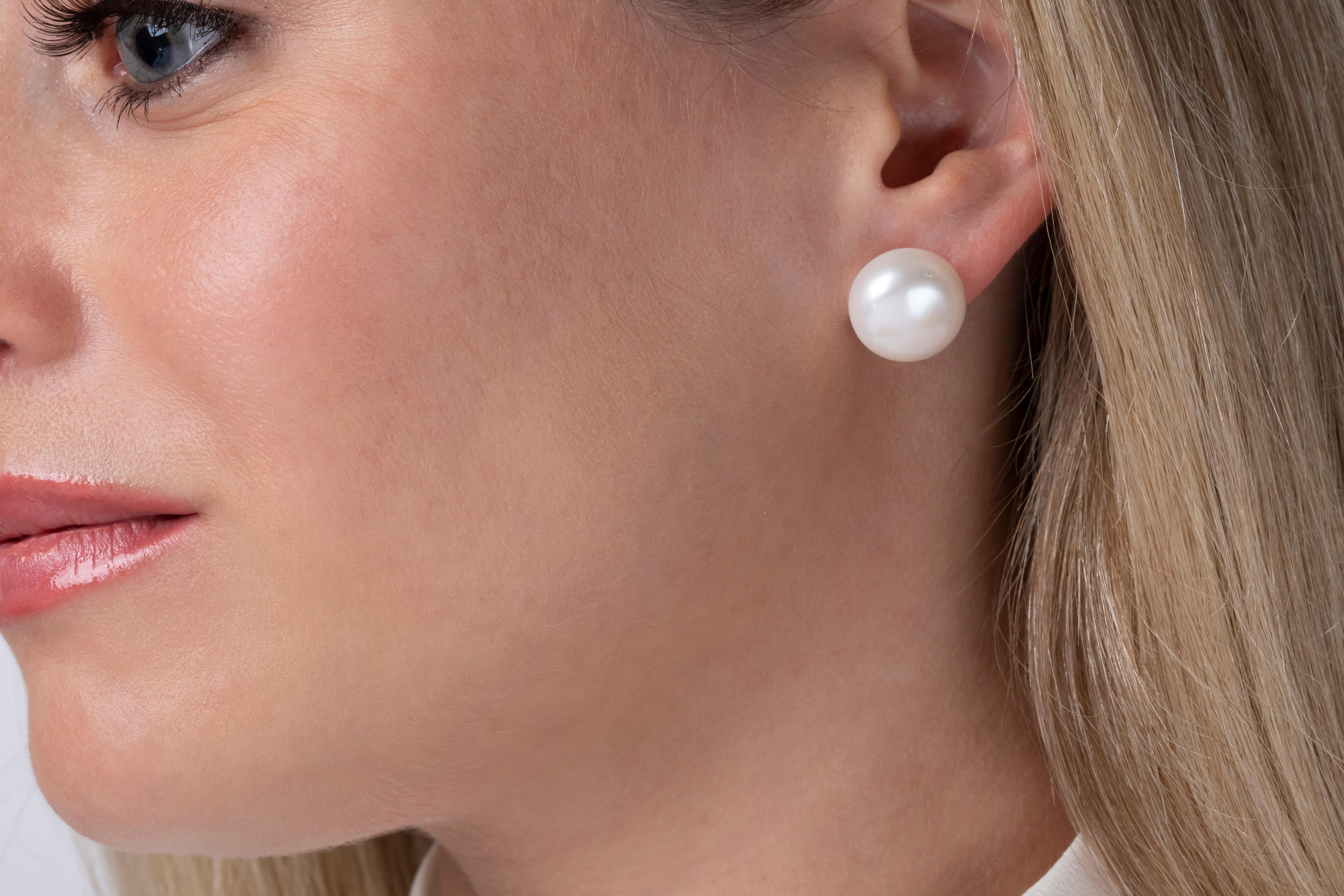 A classic stud in a large size, these earrings will add a sense of sophisticated refinement to any outfit.
-13mm Button Shape Cultured Freshwater Pearls 
-18K White Gold