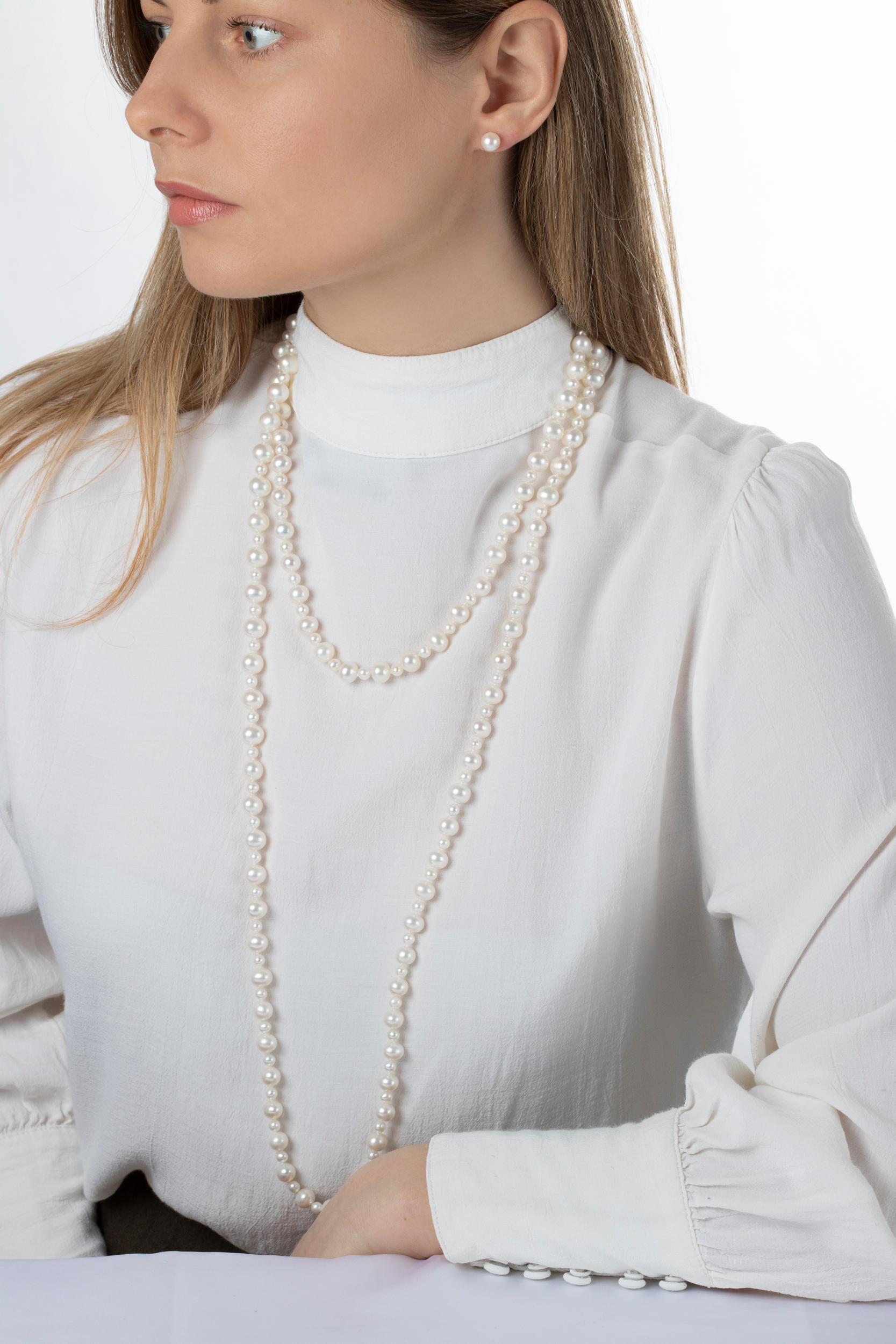 A wonderful row of perfectly matched cultured Freshwater Pearls which alternate in size between 5mm and 9mm in a long rope style, which can be worn long and short. Easy to combine with every type of outfit, this piece will be a welcomed edition for