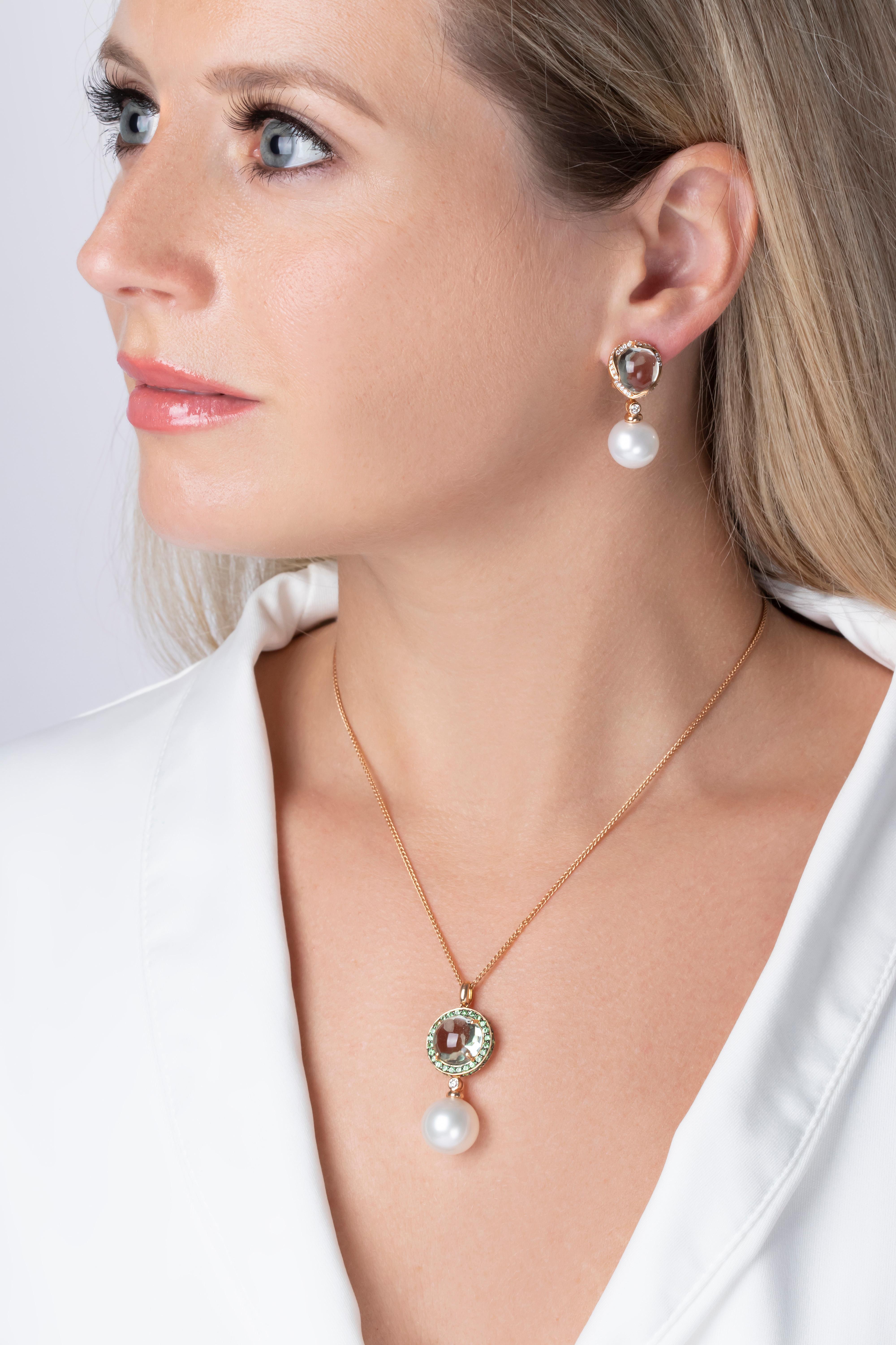 This bold pendant features a pretty faceted green amethyst in within a halo of Tsavorite garnets, set off with a lustrous 14.1mm South Sea pearl. This delightful necklace will add a sumptuous pop of colour to any outfit it is combined with.
Secured