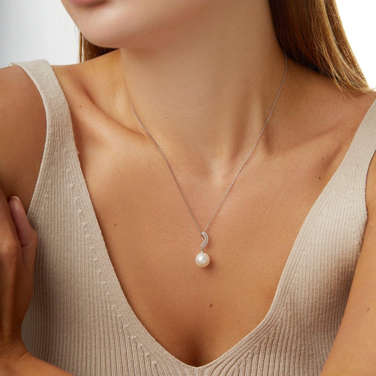 This elegant pendant by Yoko London is the perfect accessory for any occasion. It features a lustrous South Sea pearl beneath a delicate diamond curve. Handcrafted in Yoko London's workshop, this pendant is a must have addition to any jewellery box.
