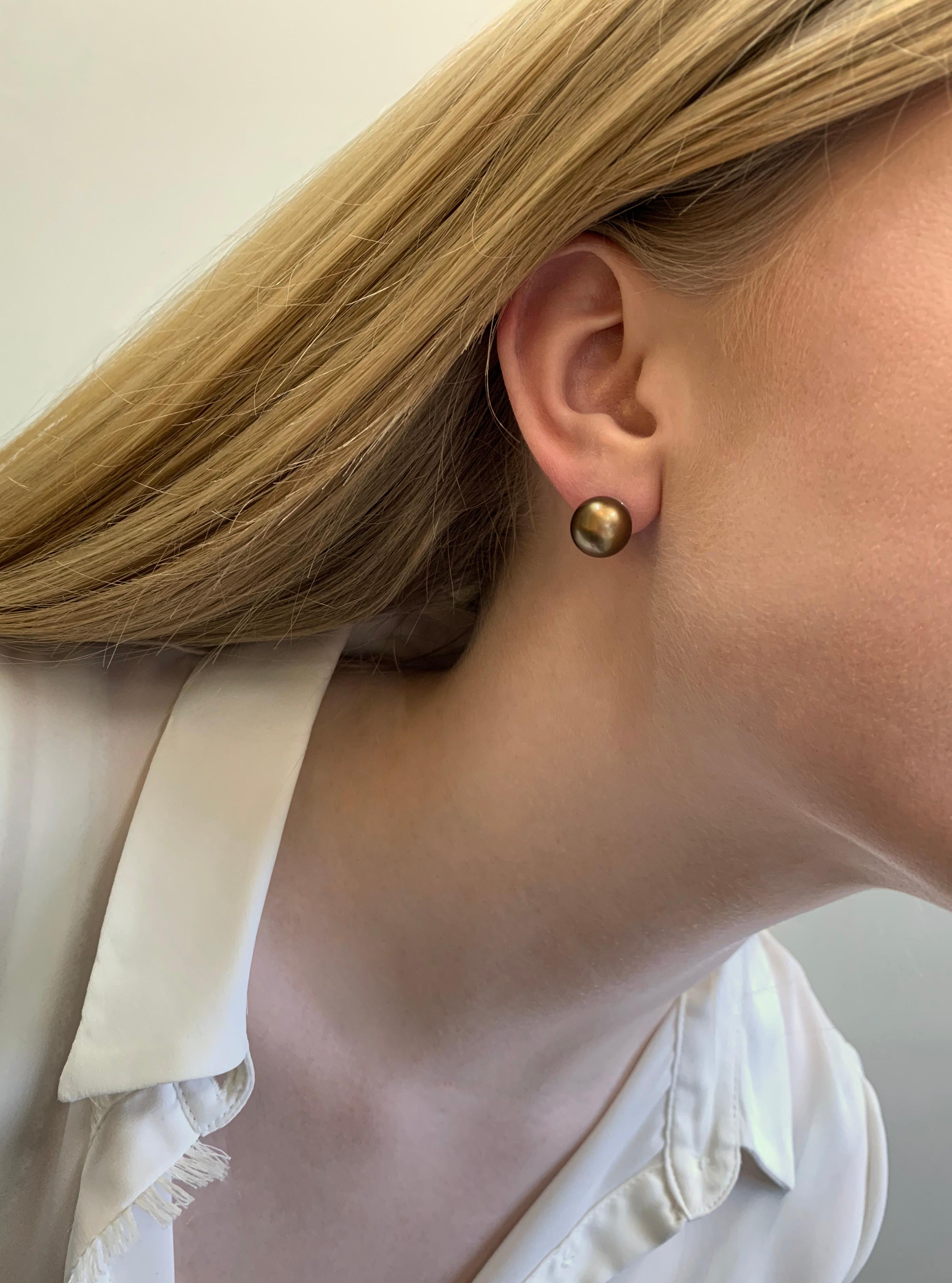 These striking earrings from Yoko London feature Chocolate-coloured Tahitian pearls, offering a unique twist to an otherwise classic design. Set in 18 Karat Yellow Gold to enrich the rich, sumptuous colour of the pearls, these earrings make a