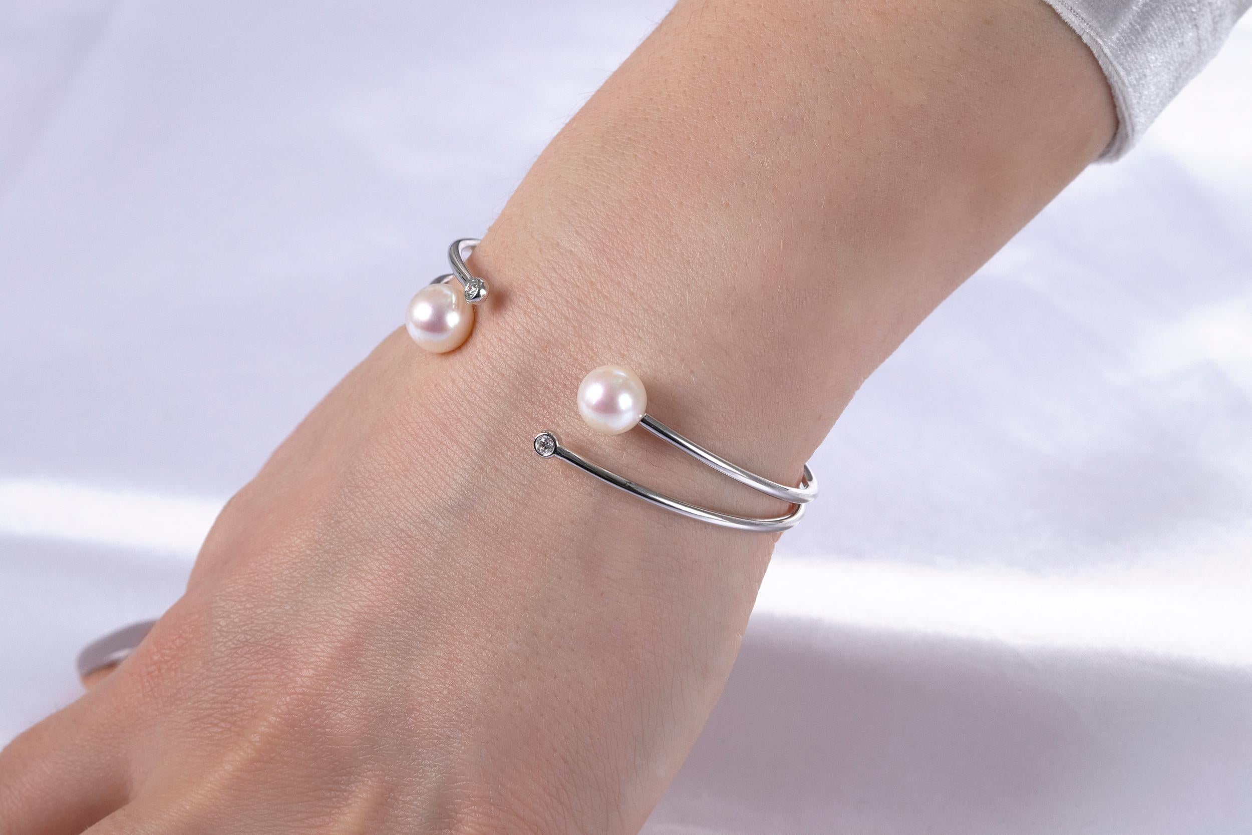 This elegant bangle by Yoko London features lustrous Freshwater pearls accentuated by sparkling white diamonds in an elegant double pronged bangle design. The bangle is crafted with flexibility, allowing it to fit wrist sizes from small (6.5inches)