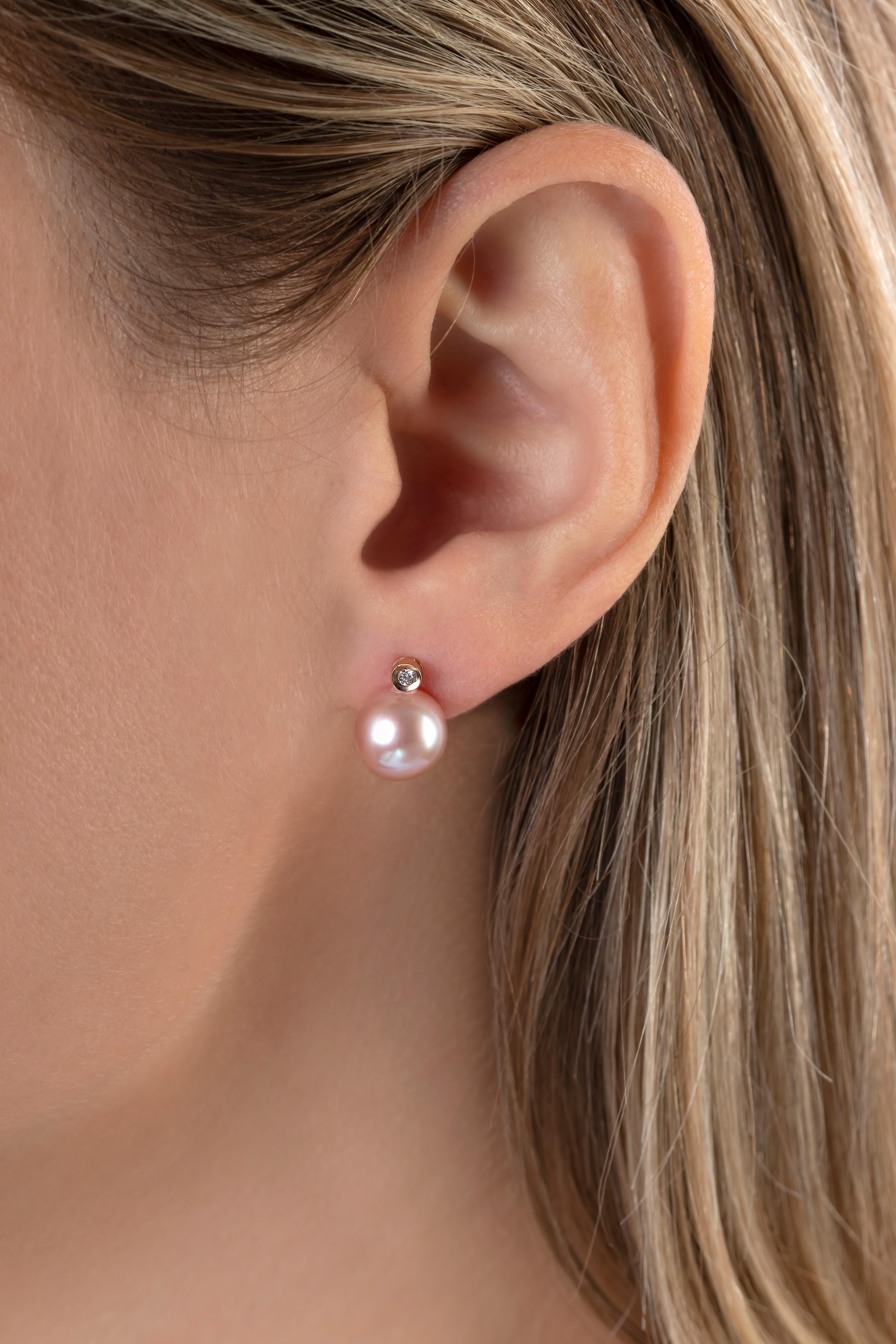 These delicate earrings by Yoko London feature sumptuous, natural colour pink Freshwater pearls set beneath a solitaire diamond. Timeless and elegant, these elegant earrings are the perfect accessory for both daytime and evening looks. 
-	9.5-10mm