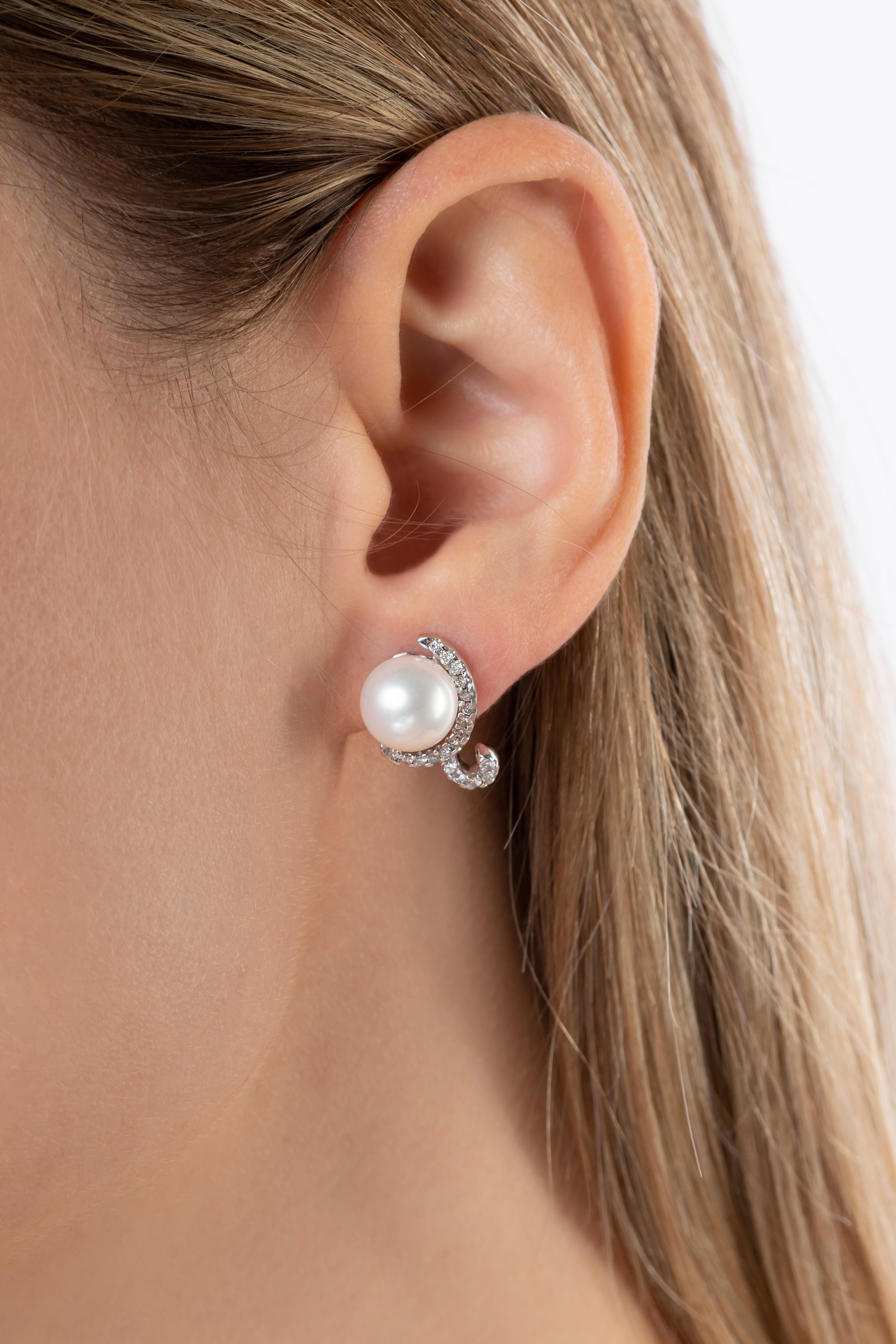 These captivating earrings by Yoko London feature lustrous Freshwater pearls embedded in an ornate diamond setting. Beguiling and elegant, these unique earrings will add a touch of unparalleled elegance to both daytime and evening looks. Pair with