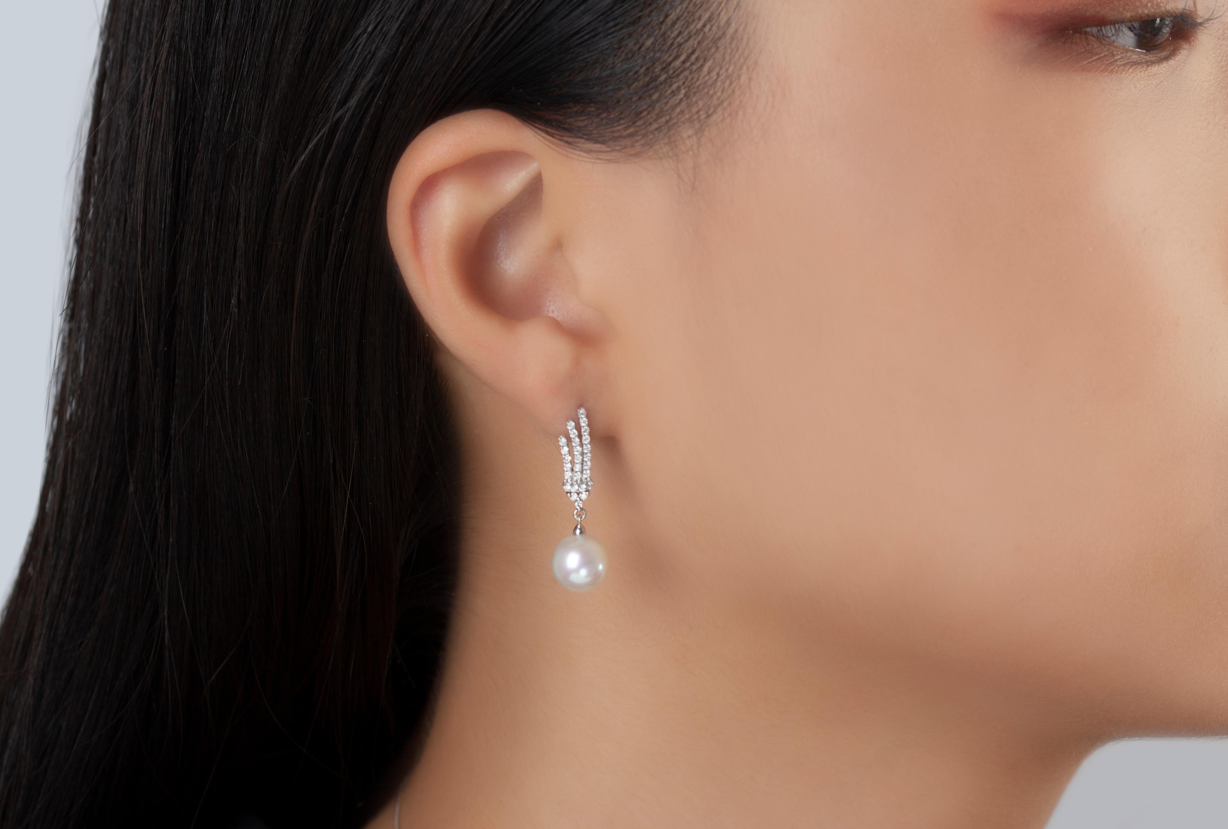 These elegant earrings by Yoko London feature lustrous 9-9.5mm Freshwater pearls beneath a striking arrangement of diamonds. Pair these intricate earrings with any evening look to add a touch of unparalleled elegance.  
-9-9.5mm Freshwater Pearls