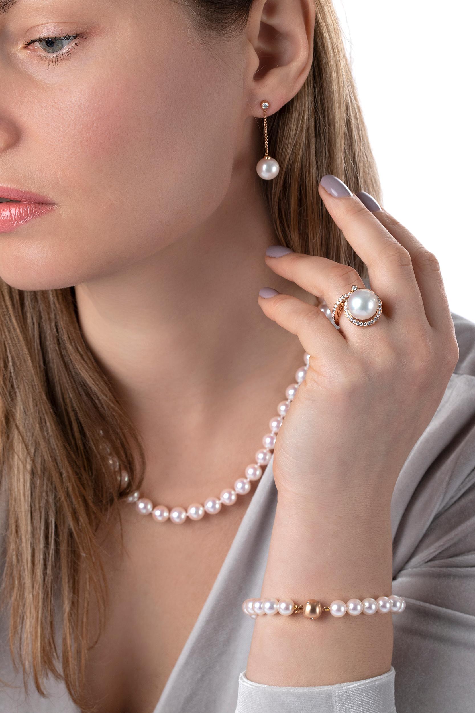 These elegant earrings feature lustrous, high-quality Freshwater pearls, accentuated by an 18K rose gold chain and scintillating solitaire diamonds. A contemporary way to wear pearls, these striking earrings will elevate any outfit. Secured with a