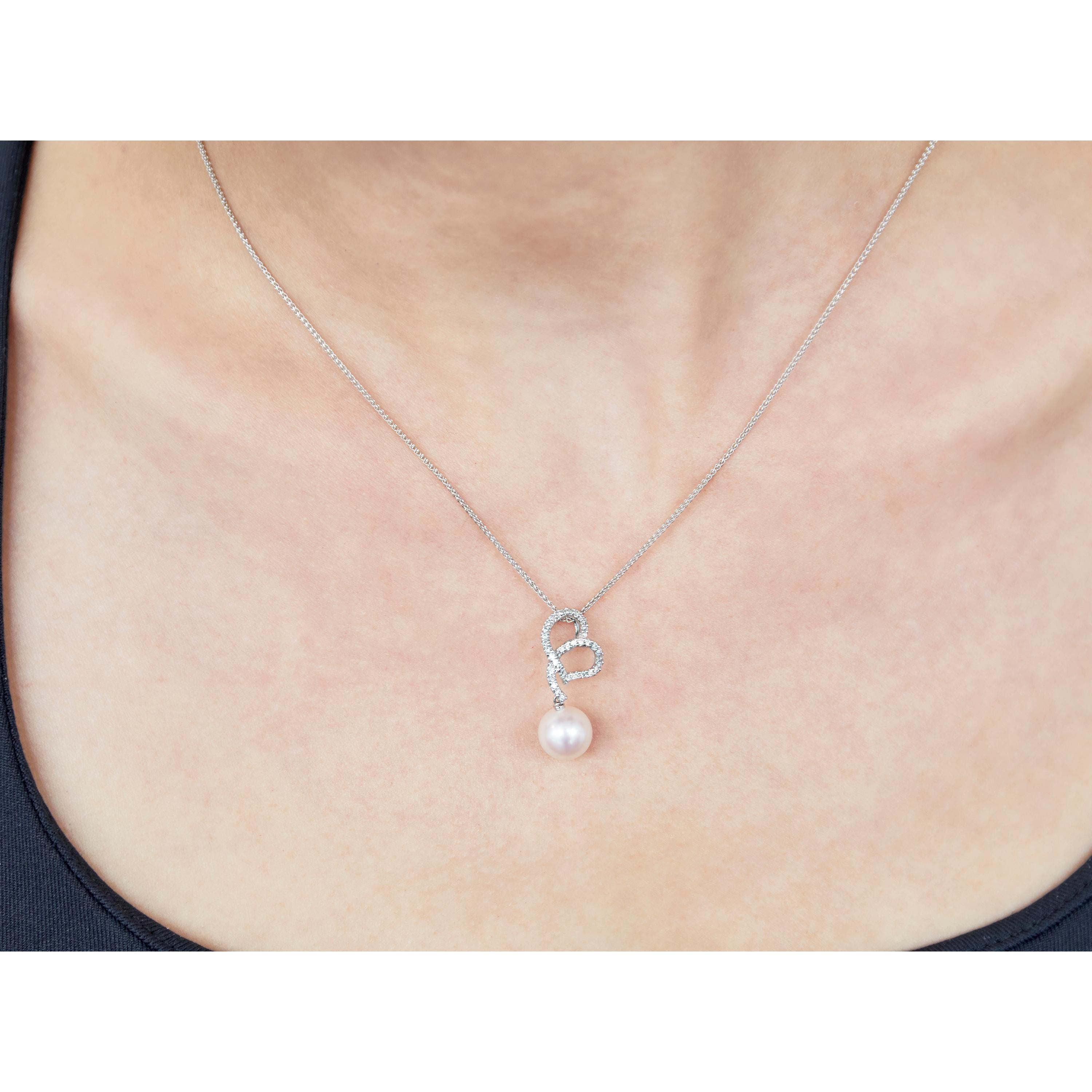 This charming pendant by Yoko London features a lustrous Freshwater pearl set beneath diamonds set in the shape of an abstract heart. The 18 Karat white gold setting serves to perfectly enrich the lustre of the pearl and the sparkle of the diamonds.