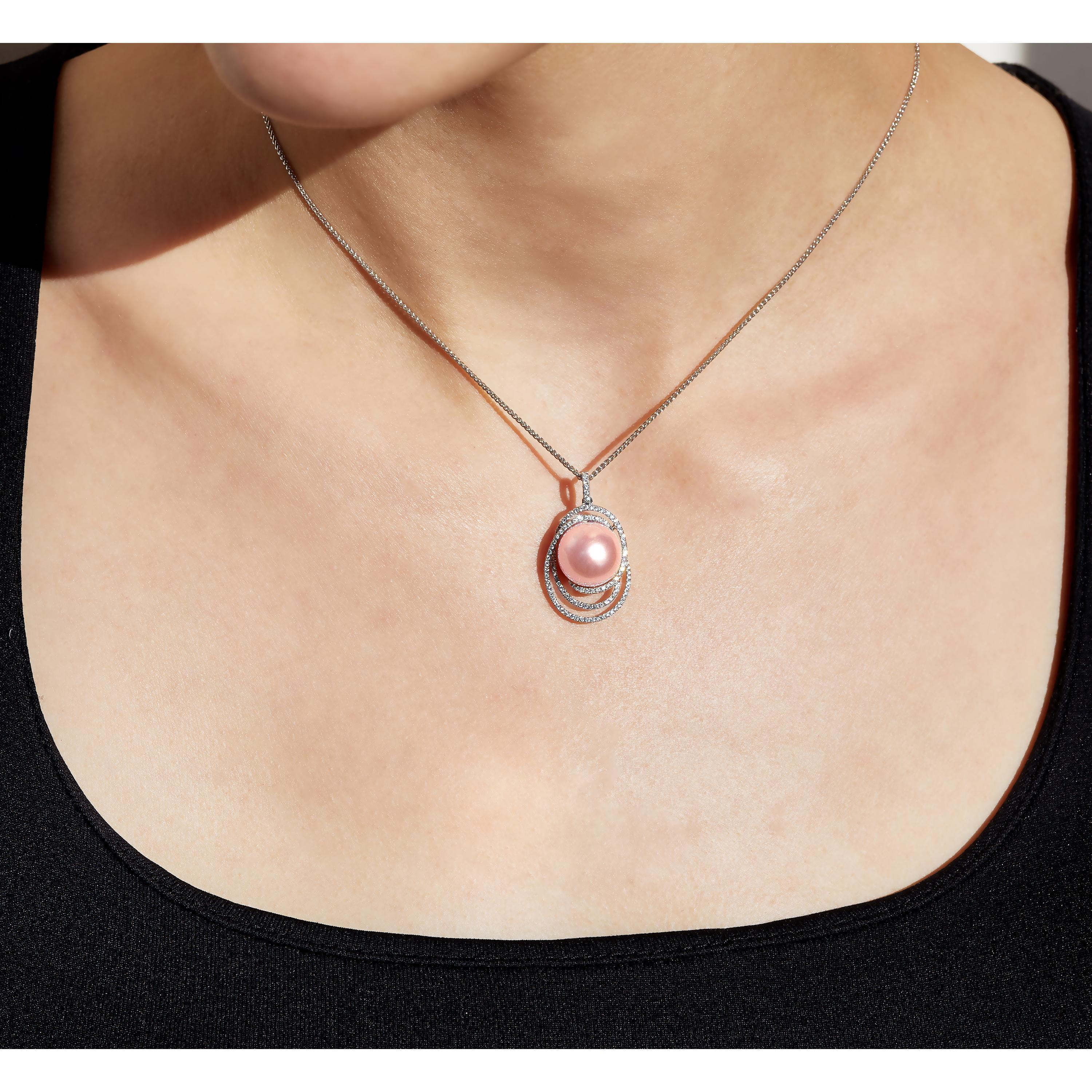 This elegant pendant by Yoko London features a natural pink Freshwater pearl surrounded by delicate diamond rows. Masterfully crafted in 18 Karat white gold in our London atelier, this pendant has been completed to the highest standard. Perfect to