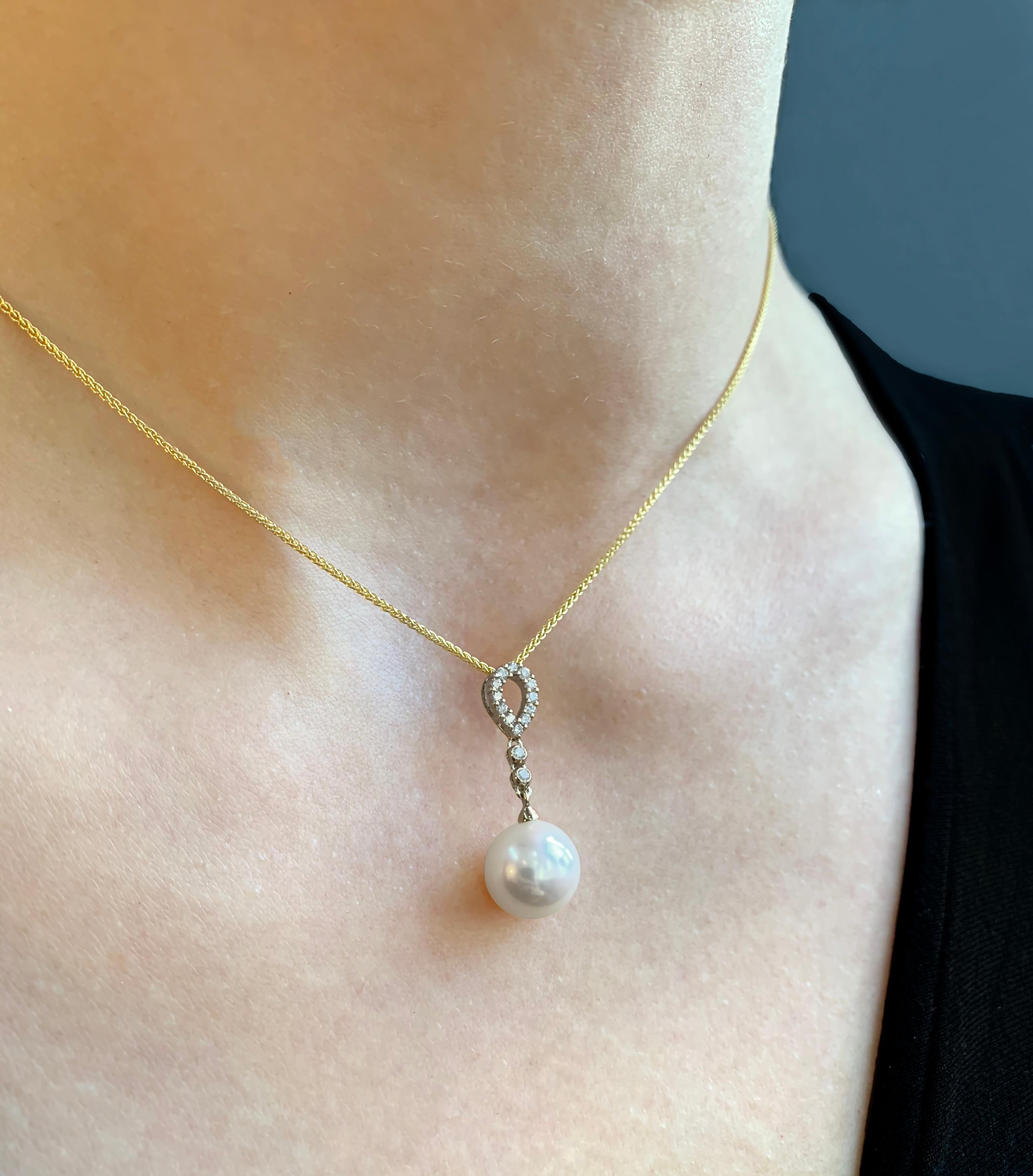 This delicate pendant by Yoko London features a lustrous Freshwater pearl beneath an elegant arrangement of diamonds. The 18 Karat Yellow Gold setting perfectly enriches the white colour of the diamonds and the lustre of the pearl. This elegant