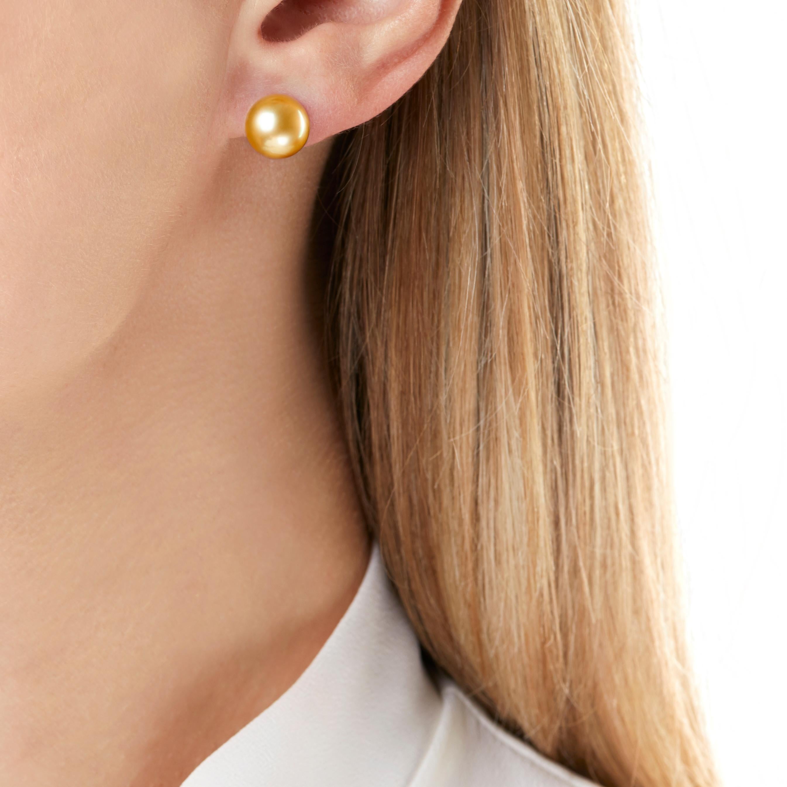 These elegant earrings by Yoko London feature rich Golden South Sea pearls on a classic 18K yellow gold post & scroll fitting. Offering a vibrant alternative to the timeless jewellery box essential, these earrings will add a touch of sophistication