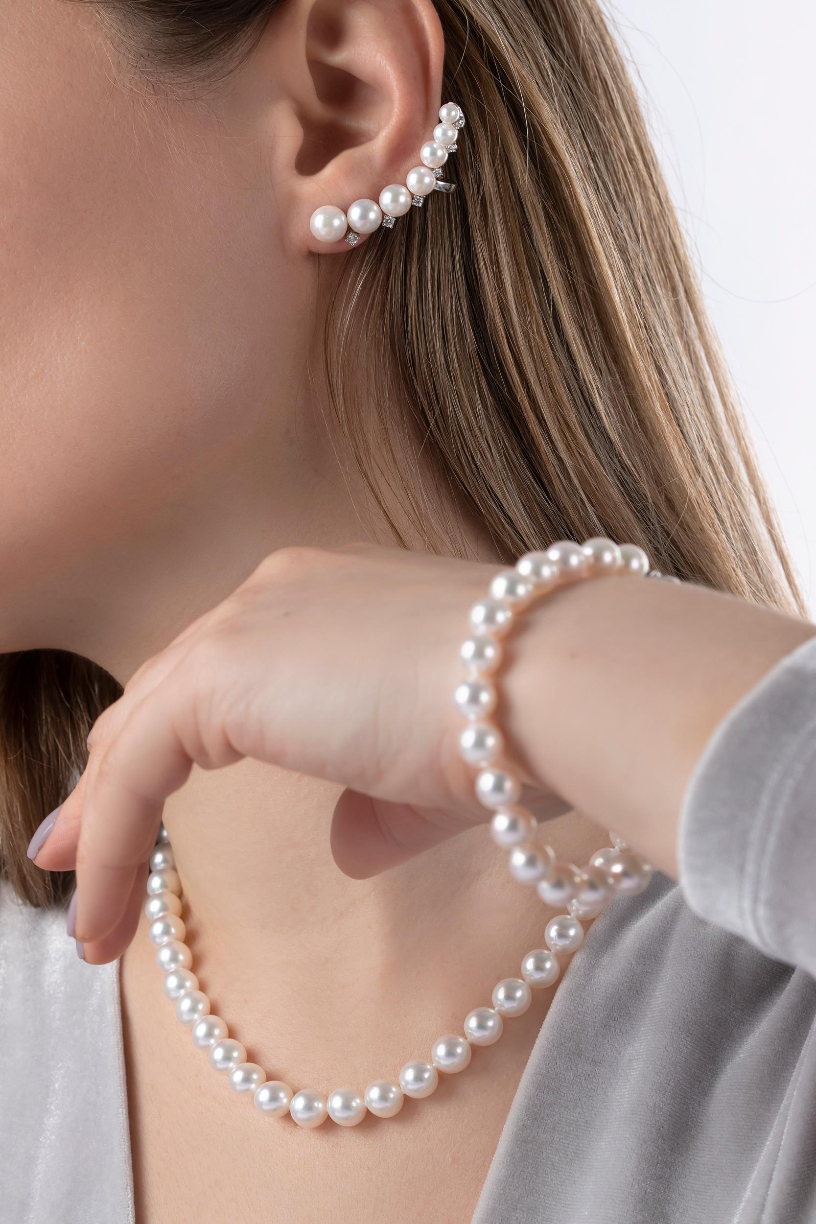 Elegant and exciting, this contemporary design by Yoko London features a climbing pattern of size-graduating Akoya pearls set among 18K White gold and sparkling white diamonds. Secured to the ear with a post and scroll fitting at the lobe and a clip