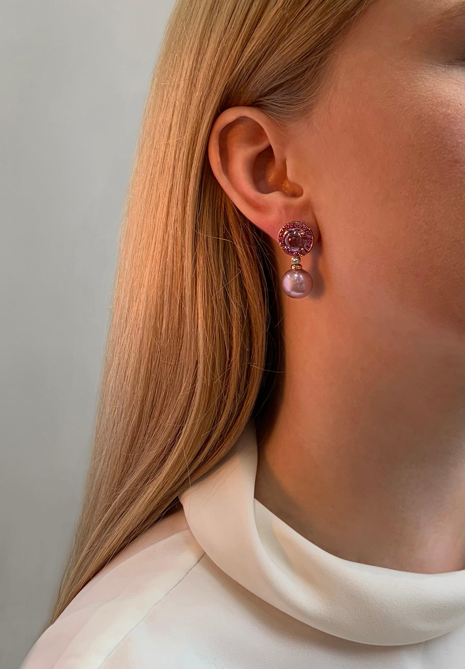 These sumptuous earrings by Yoko London feature lustrous Freshwater pearls, suspended beneath a mesmerising combination of Amethysts and purple sapphires. The 18 Karat Rose Gold setting serves to enrich the captivating hues of the pearls, amethysts