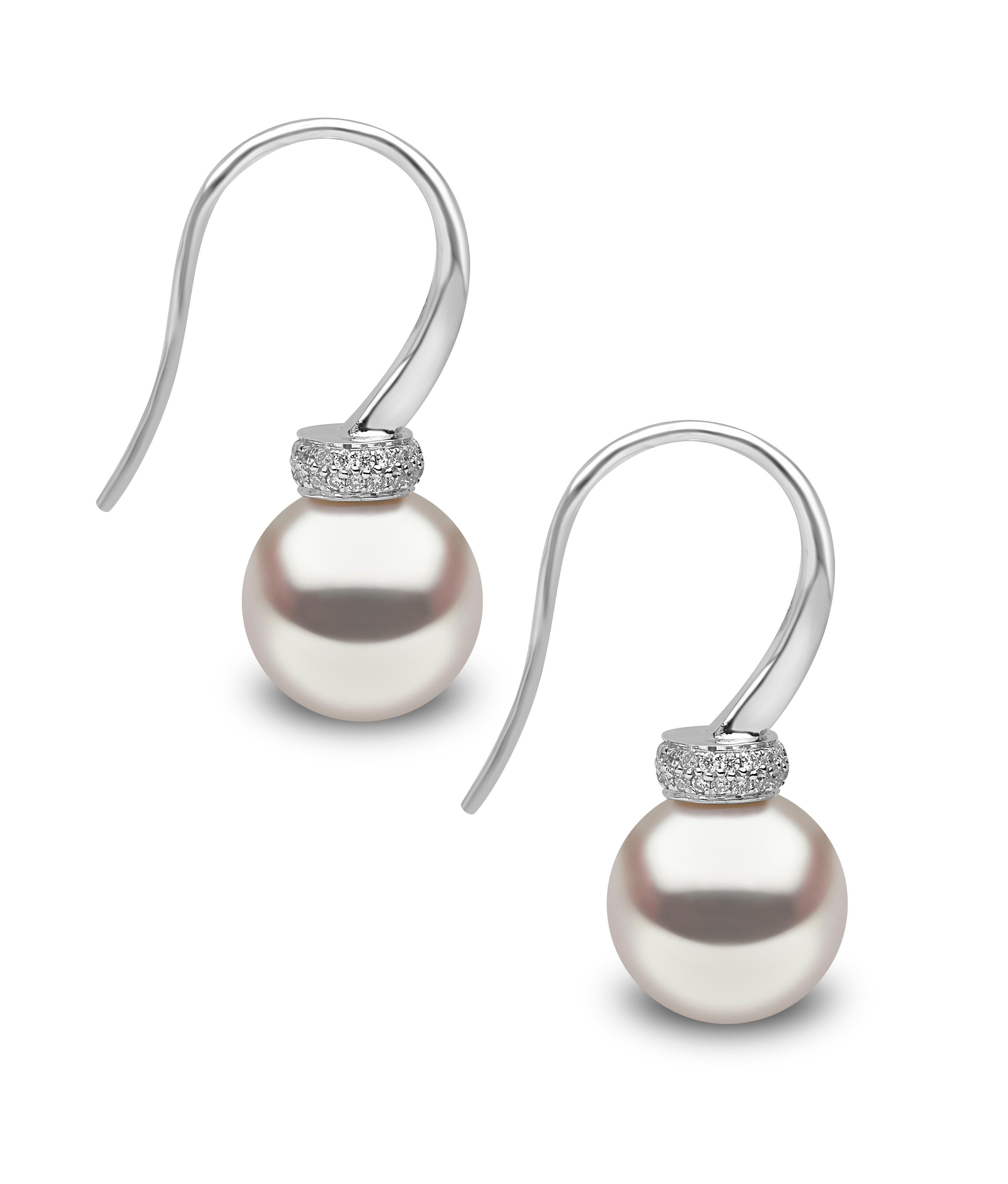 These elegant earrings by Yoko London feature lustrous Freshwater pearls beneath pave set diamonds. Simple enough for a casual day look, whilst also being glamorous enough to enhance evening attire, these earrings are a truly versatile piece which
