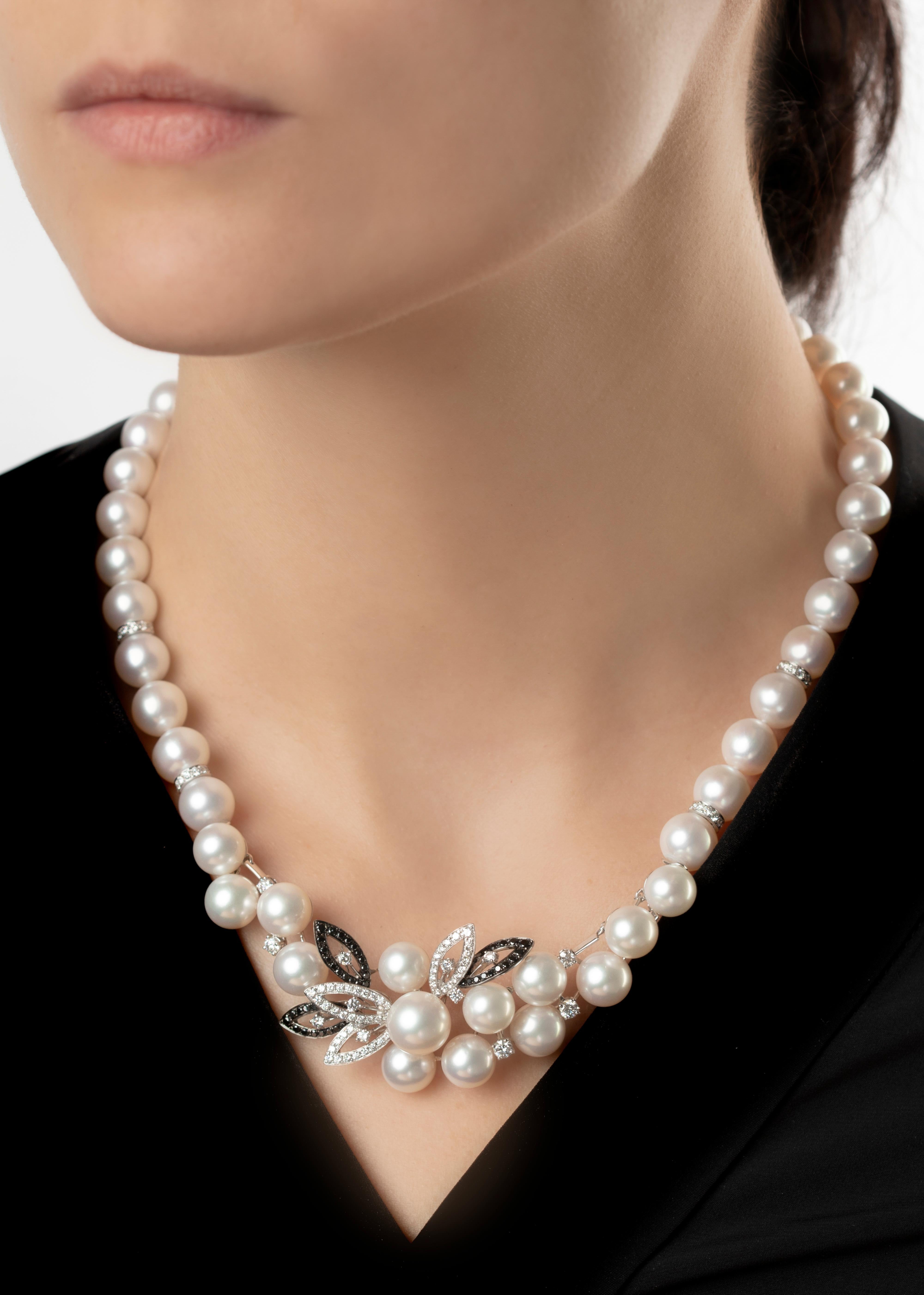 This statement necklace by Yoko London, features an elegant floral decoration at it's forefront crafted from black and white gold and finished with sparkling black and white diamonds. A polished look for both summer and winter outfits, this necklace