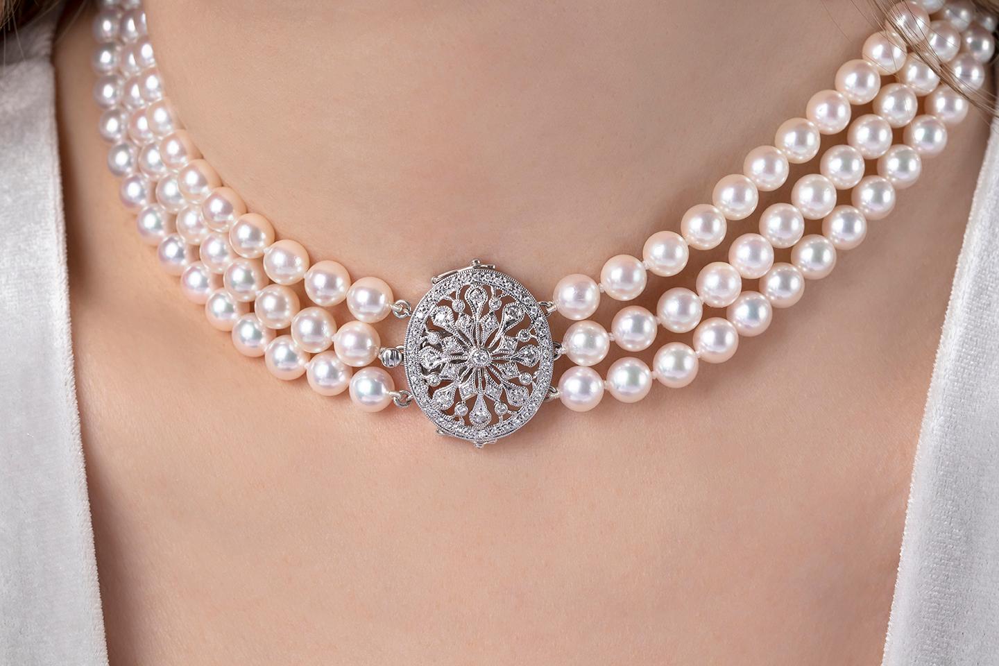This elegant choker by Yoko London features three rows of 6-6.5mm Akoya pearls, offset by an ornate, 18 Karat white gold diamond-set choker. Timeless and sophisticated, this choker will elevate any evening look. Designed and hand strung in our