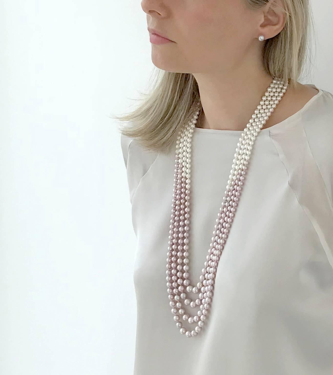 This bold Necklace by Yoko London displays a delicate pattern of Pink Freshwater Pearls at its forefront and rear, with an intersecting section of White Freshwater Pearls.

The Pearls within each row gently graduate in size, and secured to an 18