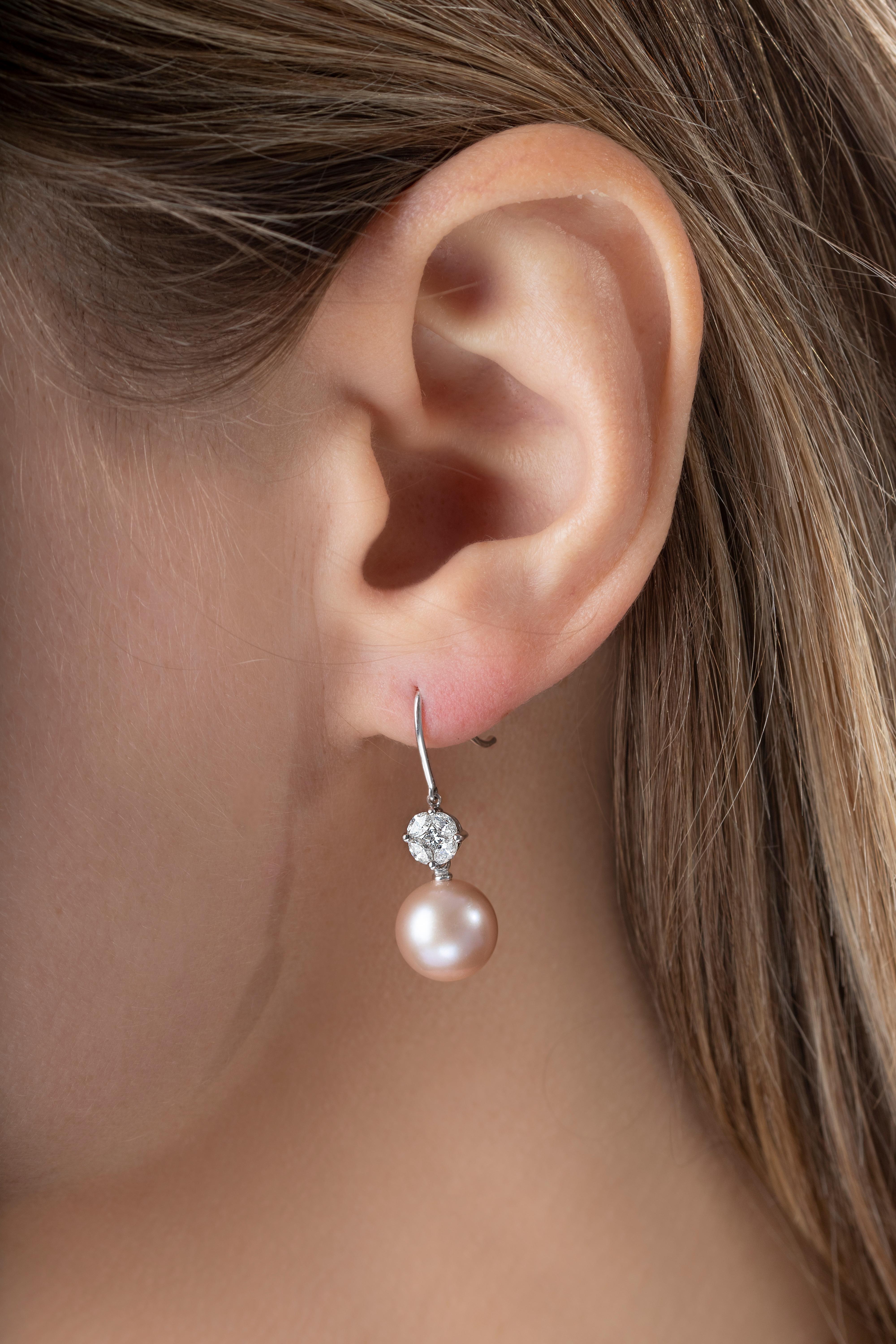This pretty earrings by Yoko London feature top quality natural coloured pink Freshwater Pearl suspended from an elegant marquise and princess cut cluster of diamonds. Bright and airy, these earrings will add a touch of femininity to every outfit
