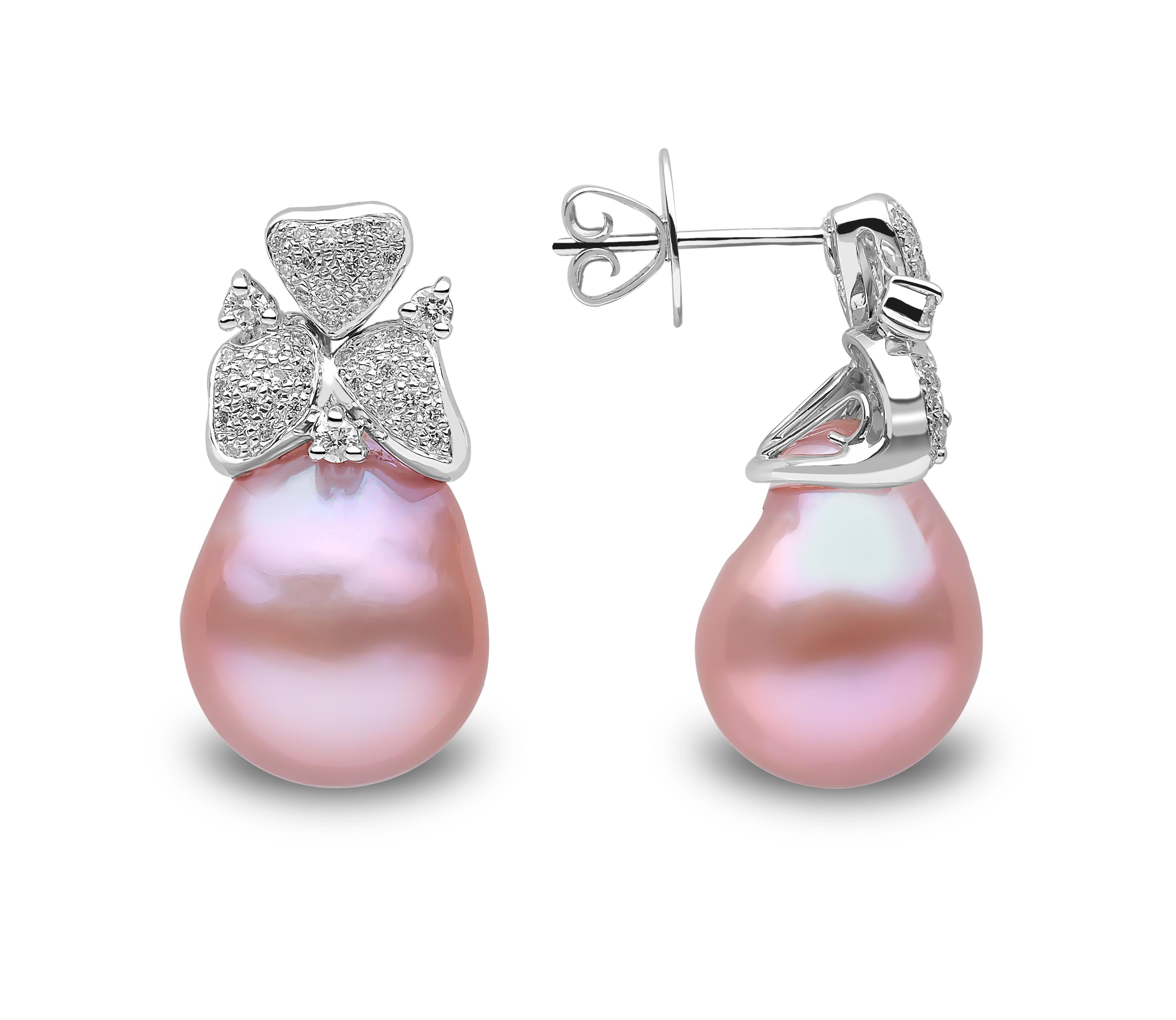 These elegant earrings feature rich Pink Freshwater pearls beneath a floral arrangement of diamonds. The earrings are set in 18K white gold to perfectly accentuate the hues of the pearl and sparkle of the diamonds. The unique colour of these