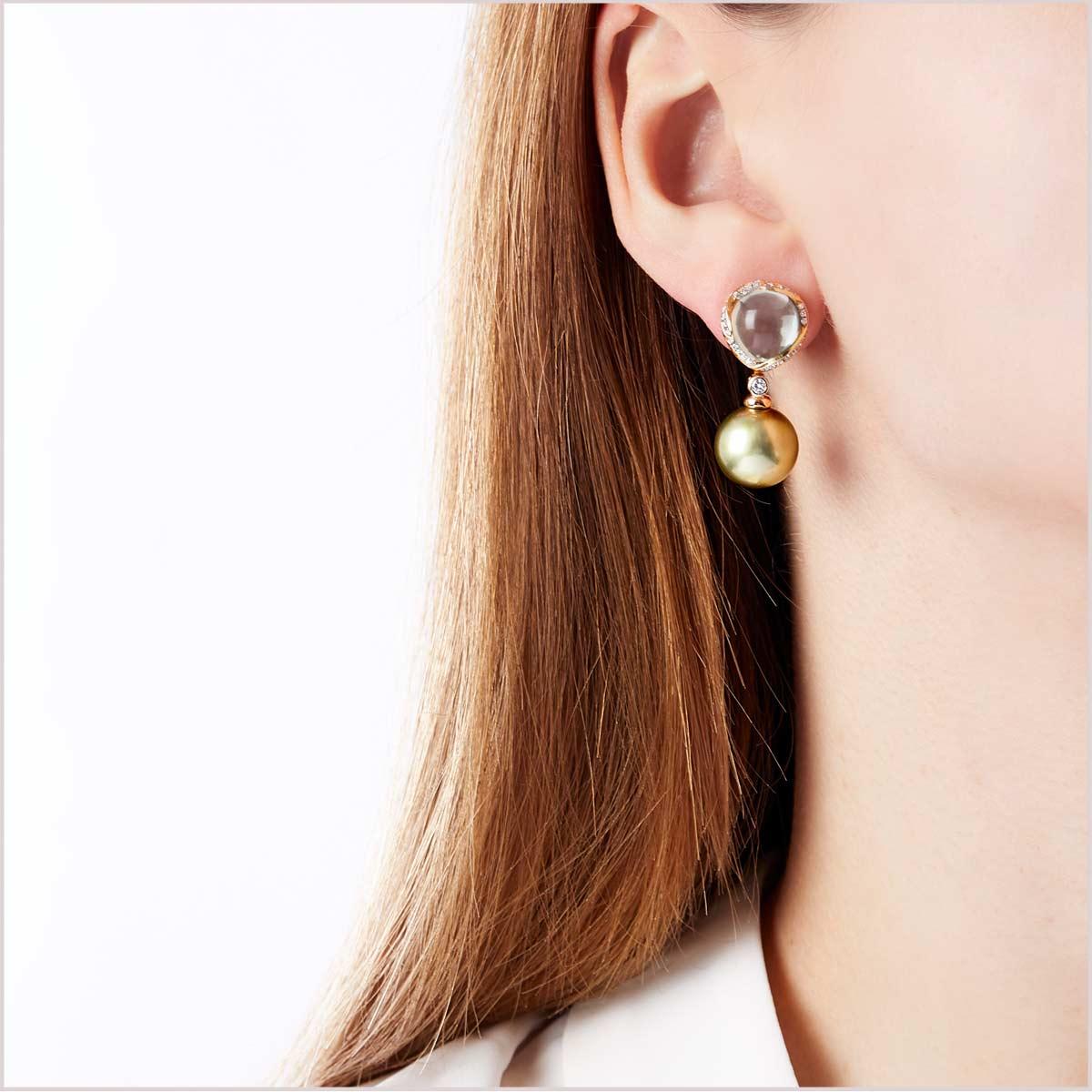 These unique earrings by Yoko London feature a lustrous Pistachio coloured Tahitian pearl beneath a mesmerising Green Amethyst encased in a surround of diamonds set in warm 18 Karat Rose Gold to enrich the hue of gems. These stunning earrings exude