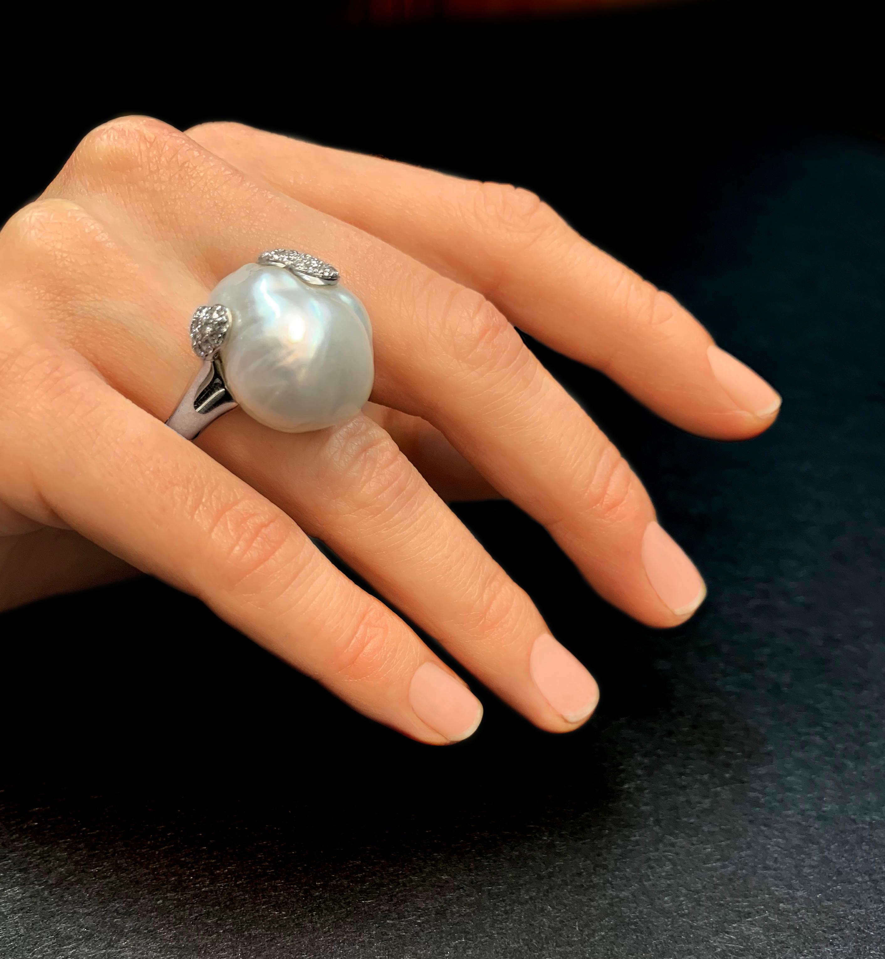 This striking ring by Yoko London features a radiant baroque pearl set amongst a contemporary arrangement of diamonds. Set in 18 Karat white gold to perfectly accentuate the lustre of the pearl and vivacity of the diamonds, this exceptional ring