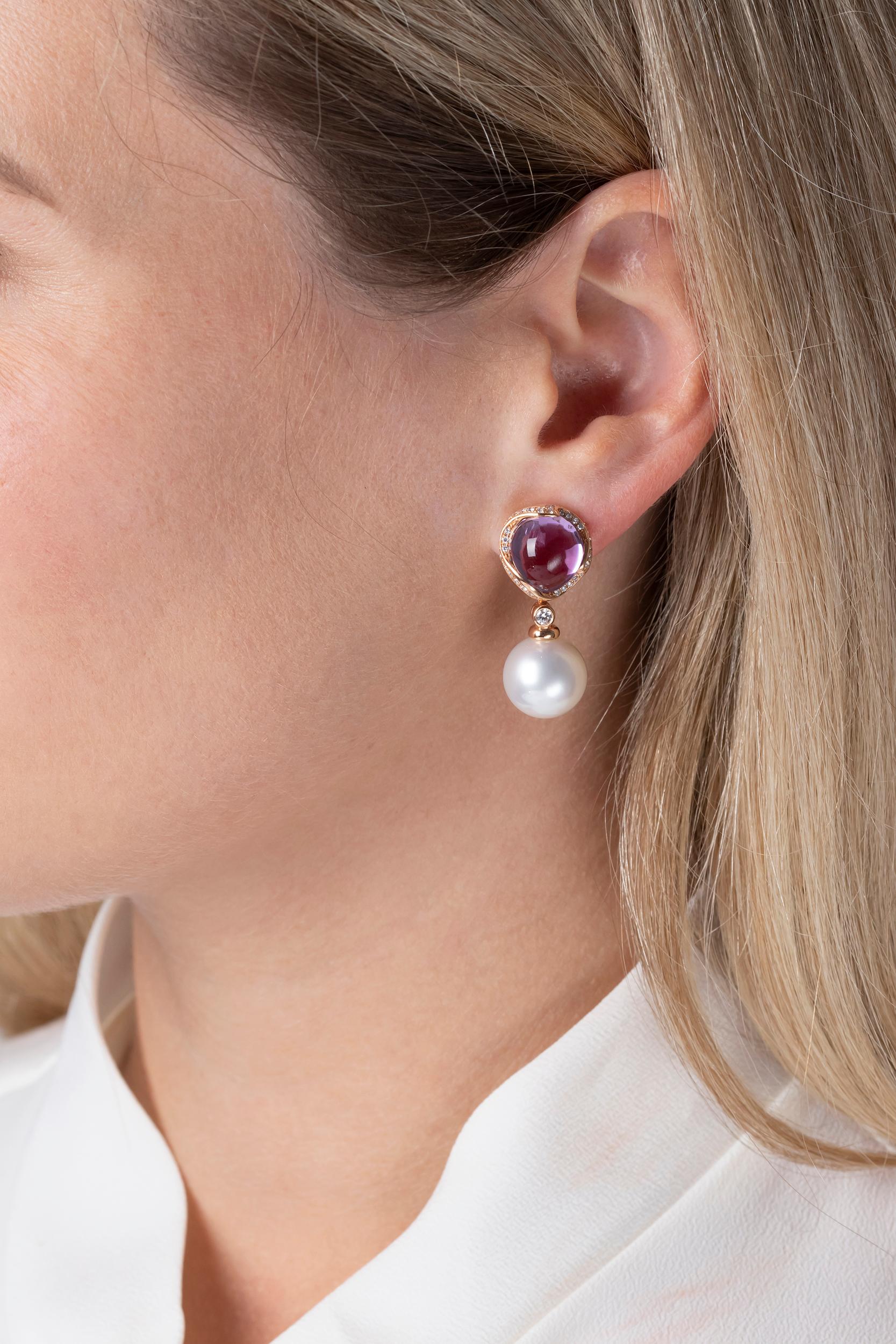 These unique earrings by Yoko London feature lustrous 12-13mm South Sea Pearls beneath vibrant amethysts and scintillating diamonds. Bold and striking, these one of a kind earrings will add a sumptuous pop of colour to any outfit. Hand-finished in