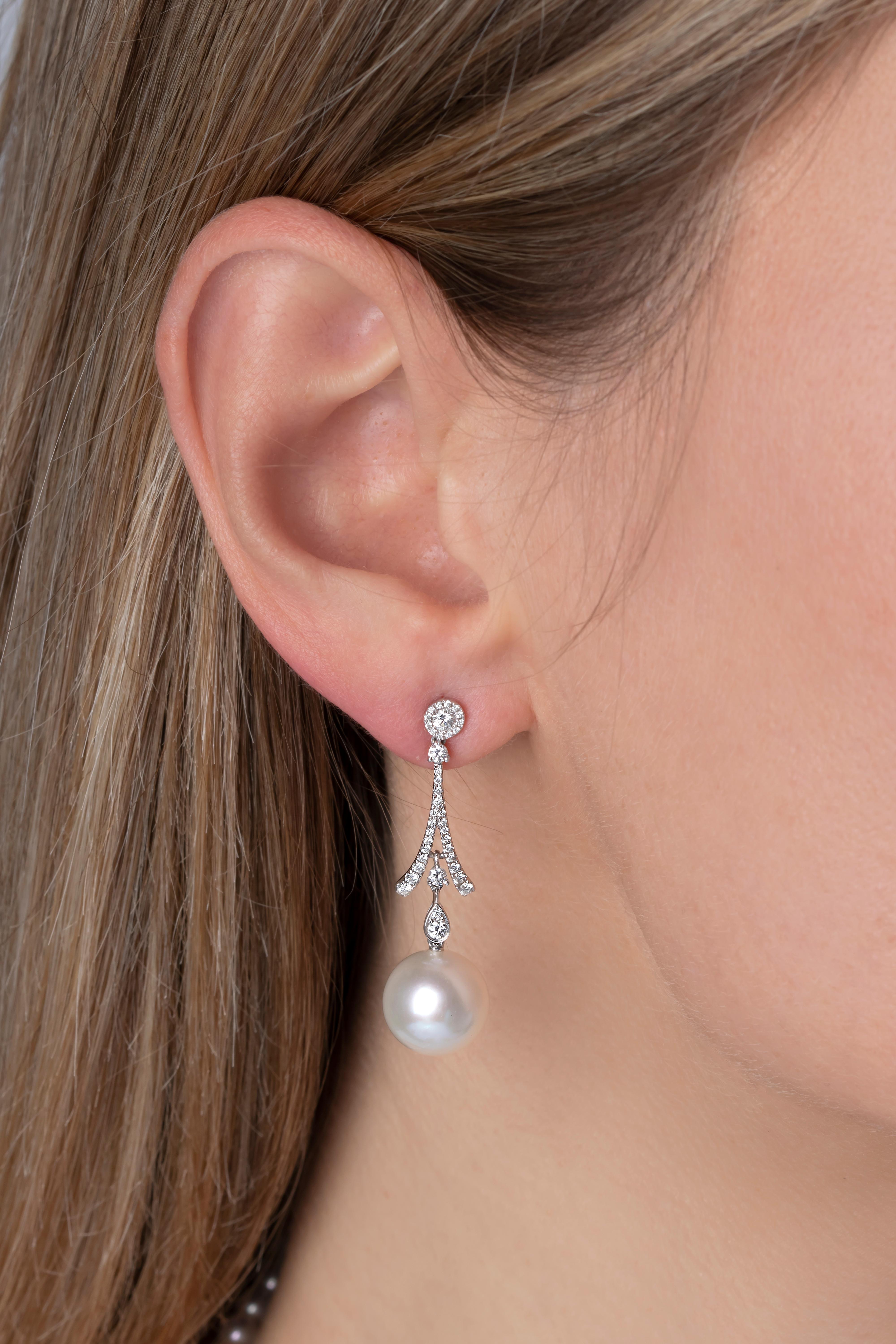 These elegant earrings by Yoko London feature cool South Sea pearls beneath a dazzling arrangement of diamonds. Striking and sophisticated, these earrings will add a touch of glamour to any evening outfit.  
-10-11mm Australian South Sea Pearls 
-78