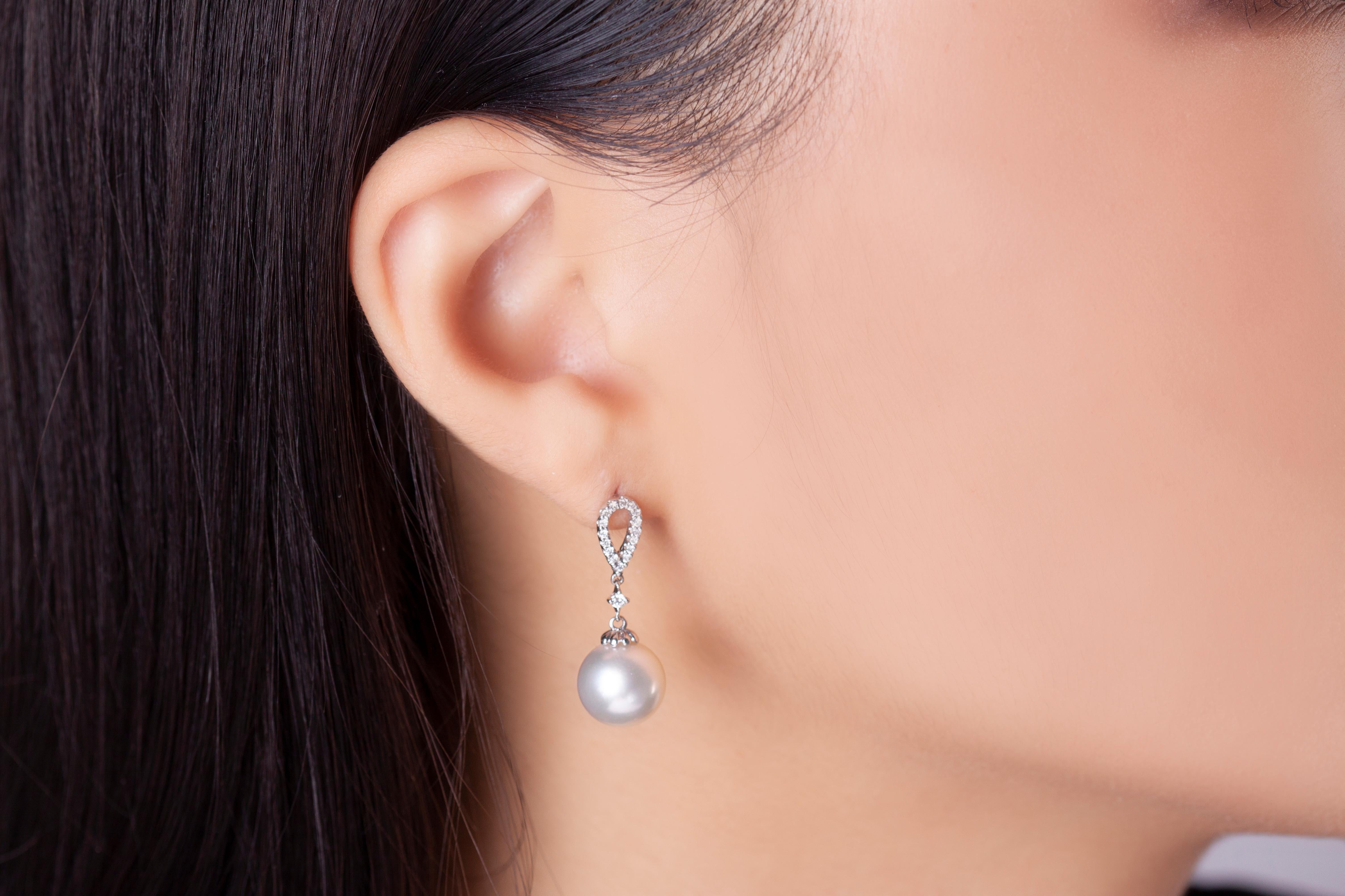 These elegant earrings by Yoko London feature lustrous 10-11mm South Sea pearls beneath a delicate arrangement of diamonds. The pearls featured at the centre of these earrings have been hand-selected by experts in our London atelier for their