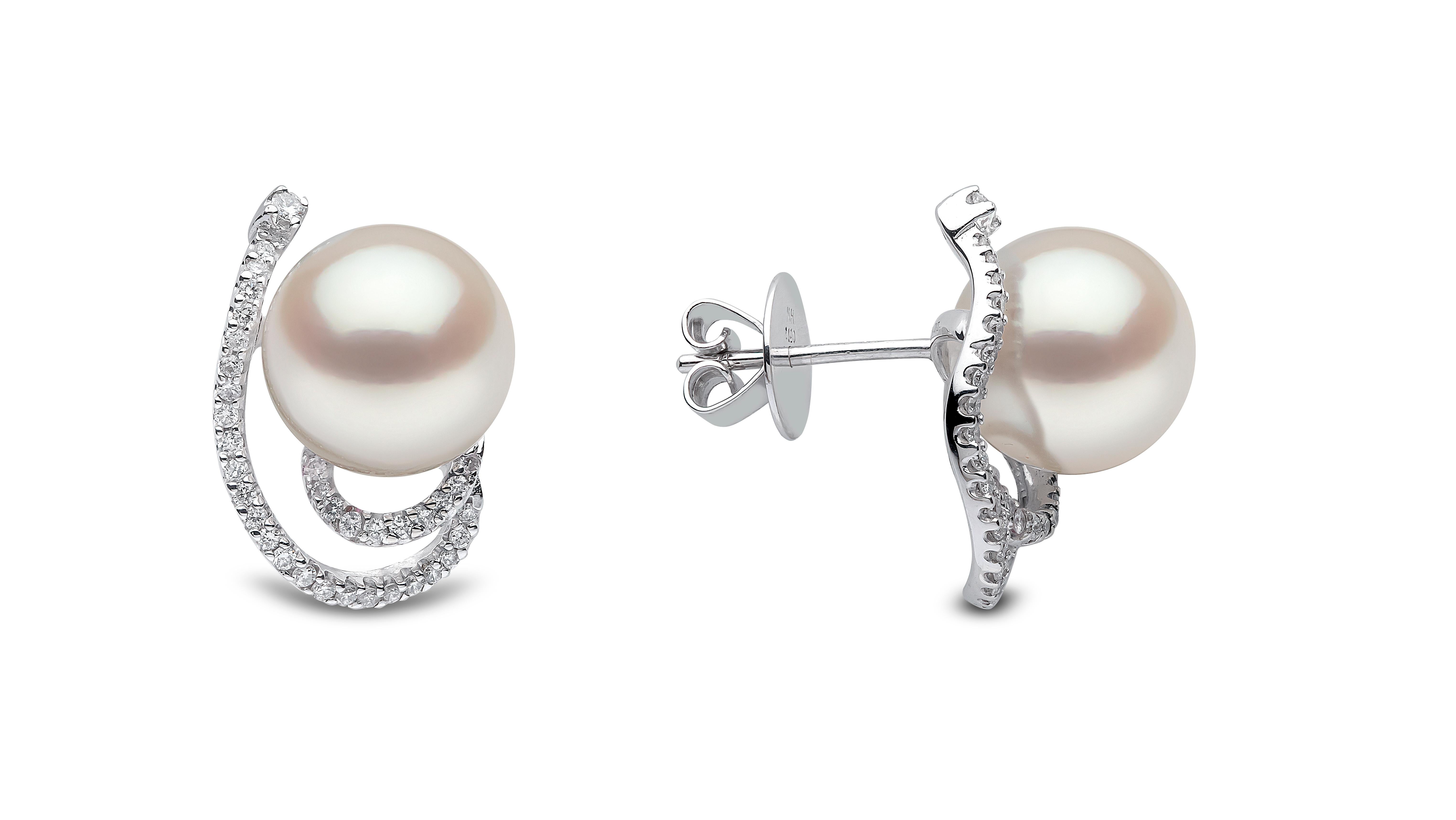 A contemporary twist of a classic stud design, these earrings by Yoko London feature a sparkling swirl around lustrous 11-12mm South Sea pearls, all set in luxurious 18K white gold. Easily styled for daily or evening outfits. Secured with a post and