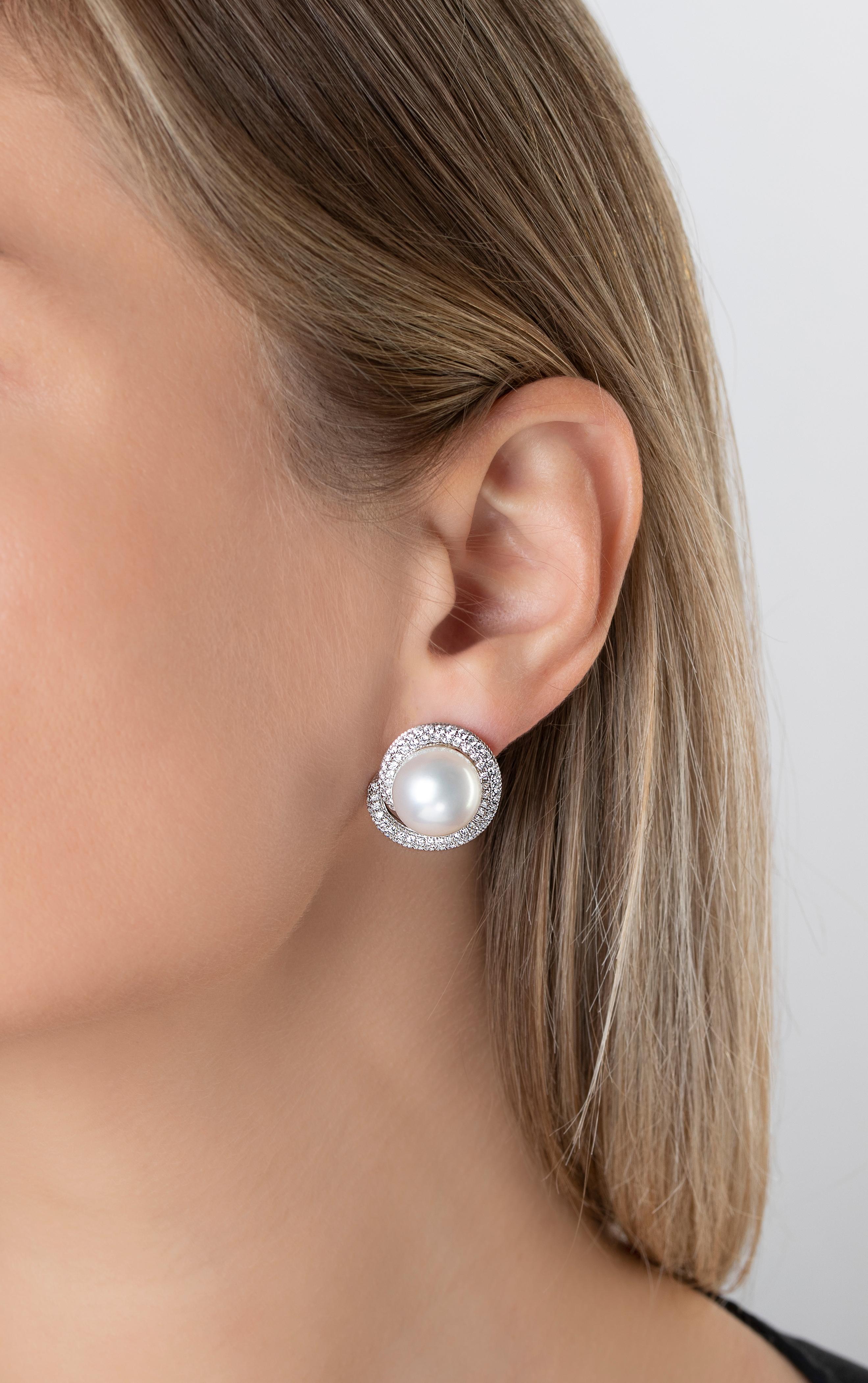The Mayfair collection by Yoko London features showstoping pieces, as exclusive as the collection's namesake district. These statement earrings feature two lustrous South Sea Pearls set among a bold twist of diamonds. Sure to make an impression,
