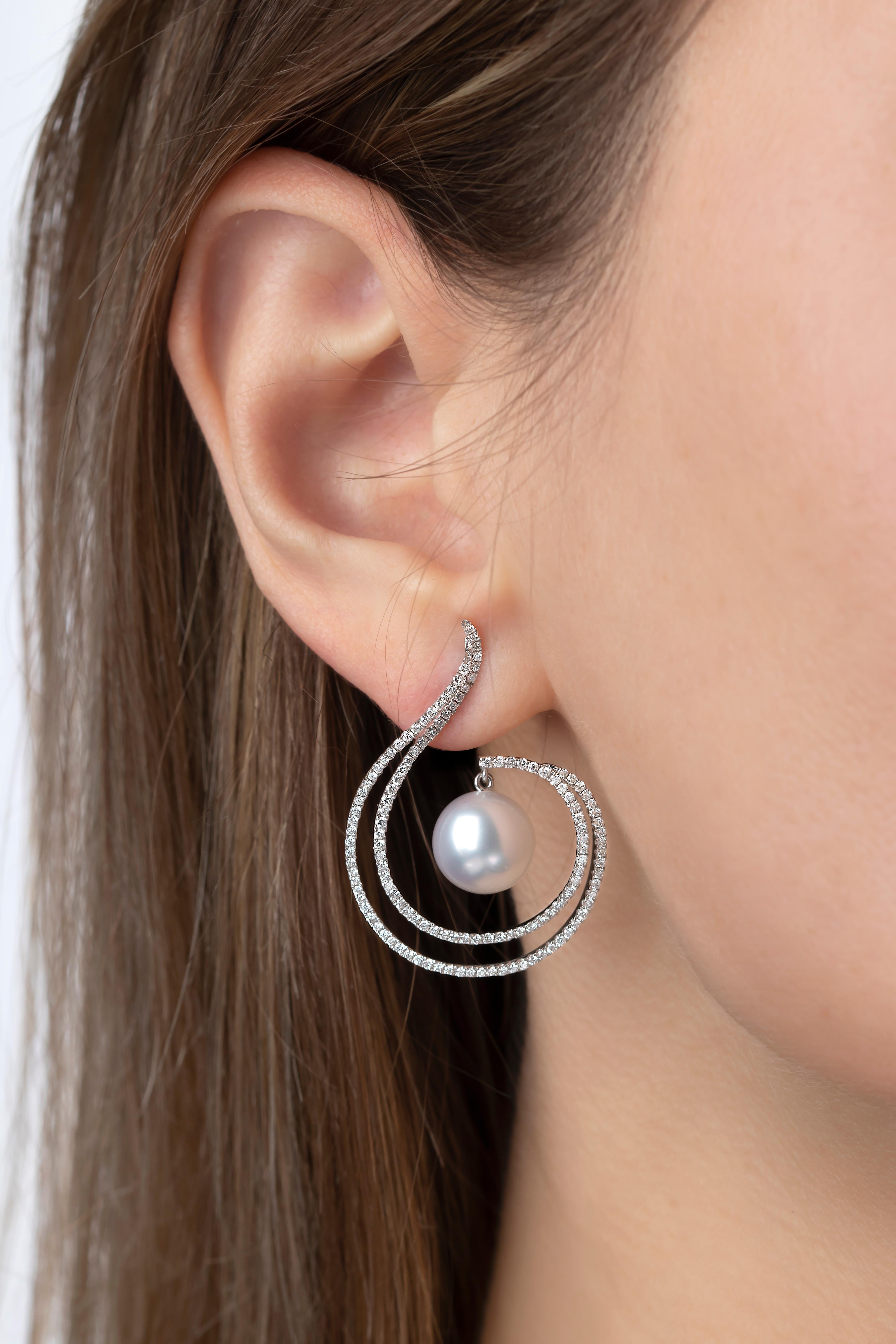 These show-stopping earrings by Yoko London feature a lustrous South Sea pearl set amongst a contemporary swirl of diamonds. The earrings are set in 18 Karat White Gold to heighten the sparkle and lustre of this winning combination of South Sea