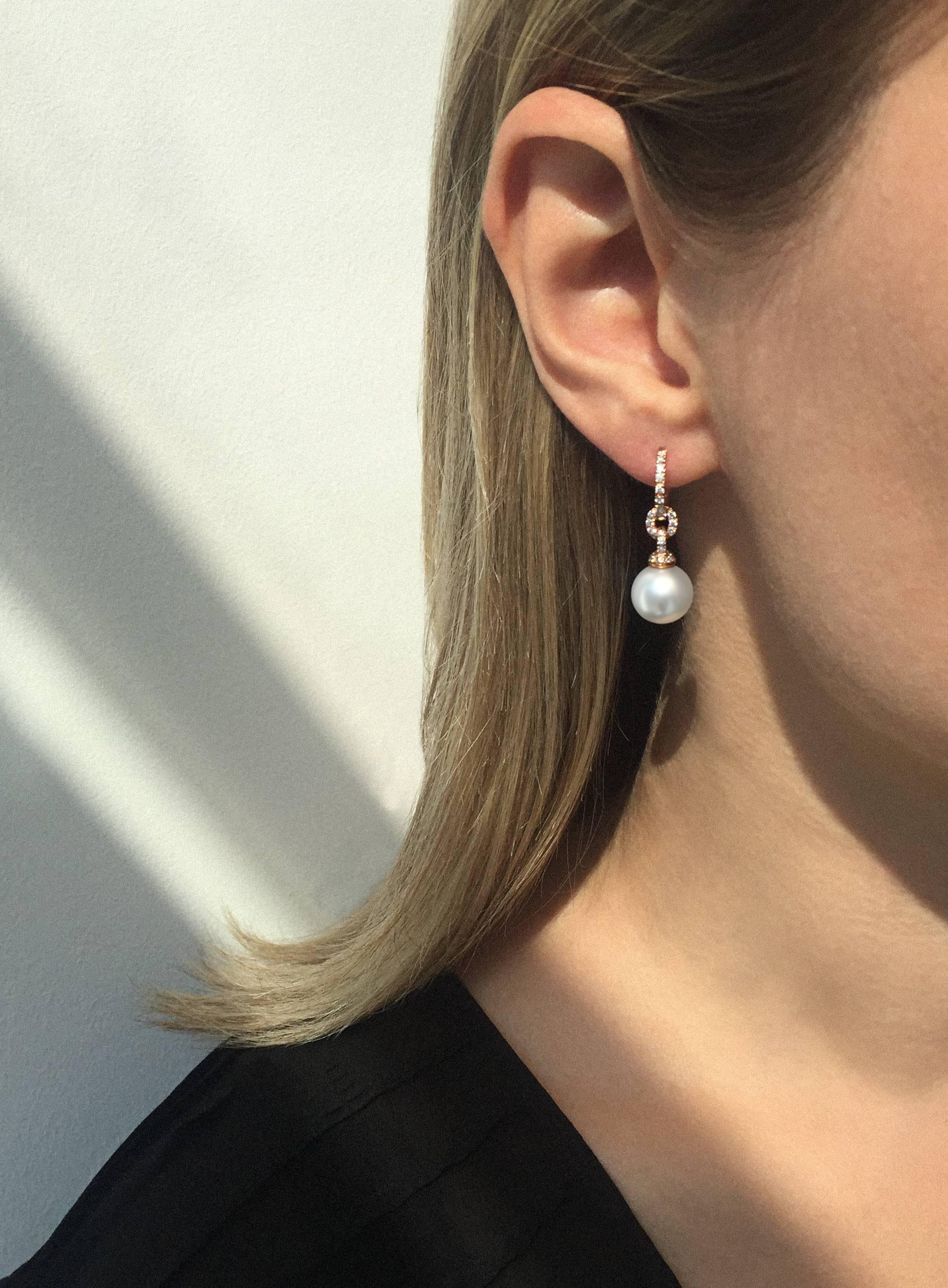 Two spectacular South Sea Pearls, hand selected for their cool lustre and even shape, have been suspended from a Diamond set hoop fitting. The hoop feature gives flexibility to the wearer, allowing them to remove the pearl for an understated elegant