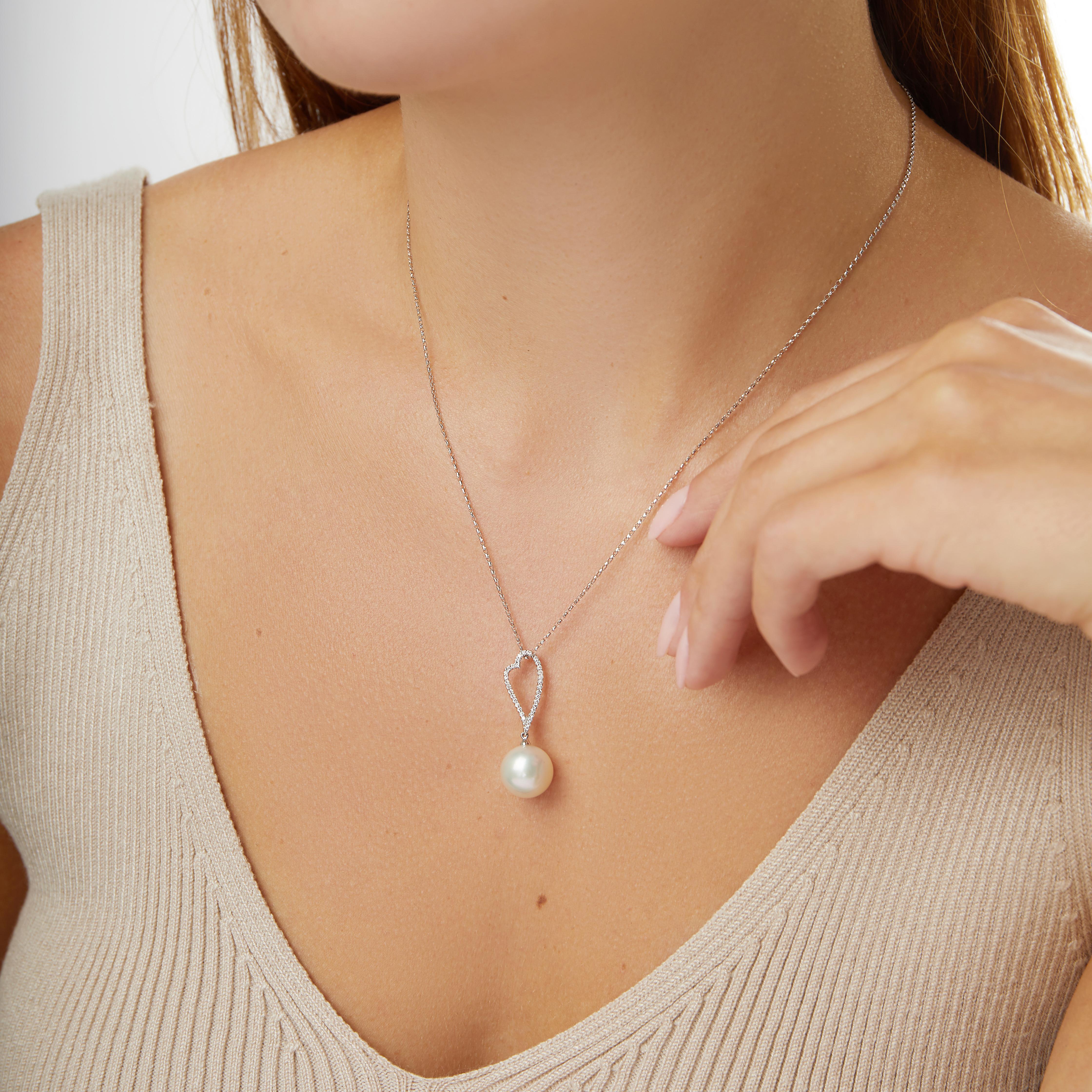 This playful pendant by Yoko London features a lustrous South Sea pearl beneath a diamond heart-motif. Set in 18 Karat white gold to enhance the lustre of the pearl and the sparkle of the diamonds. This beautiful pendant would make a romantic and