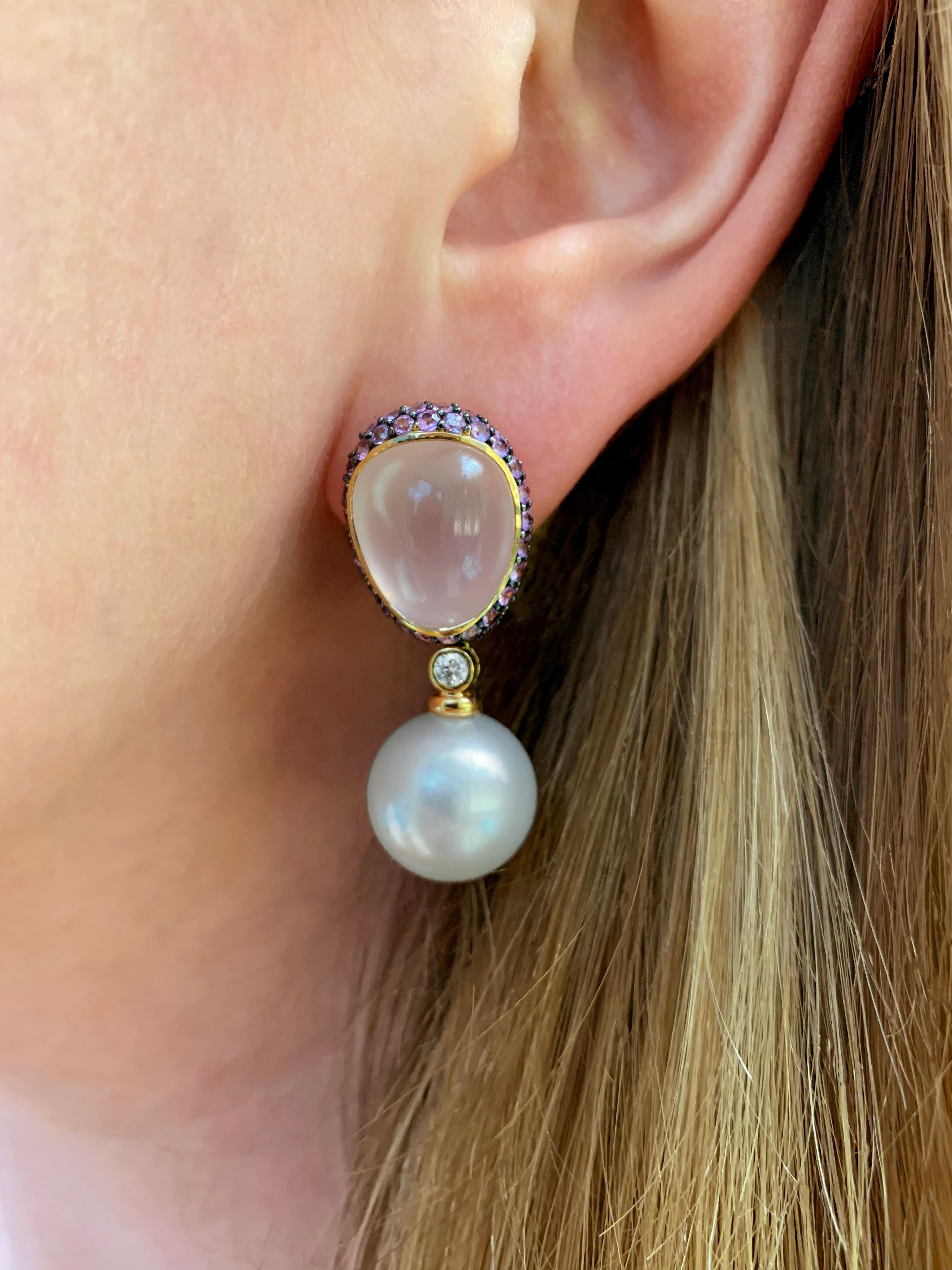 These unique earrings by Yoko London feature lustrous South Sea pearls beneath a combination of soft rose quartz and vivid pink sapphires. The mesmeric hues of the rose quartz and pink sapphires are perfectly enriched by the 18 Karat rose gold