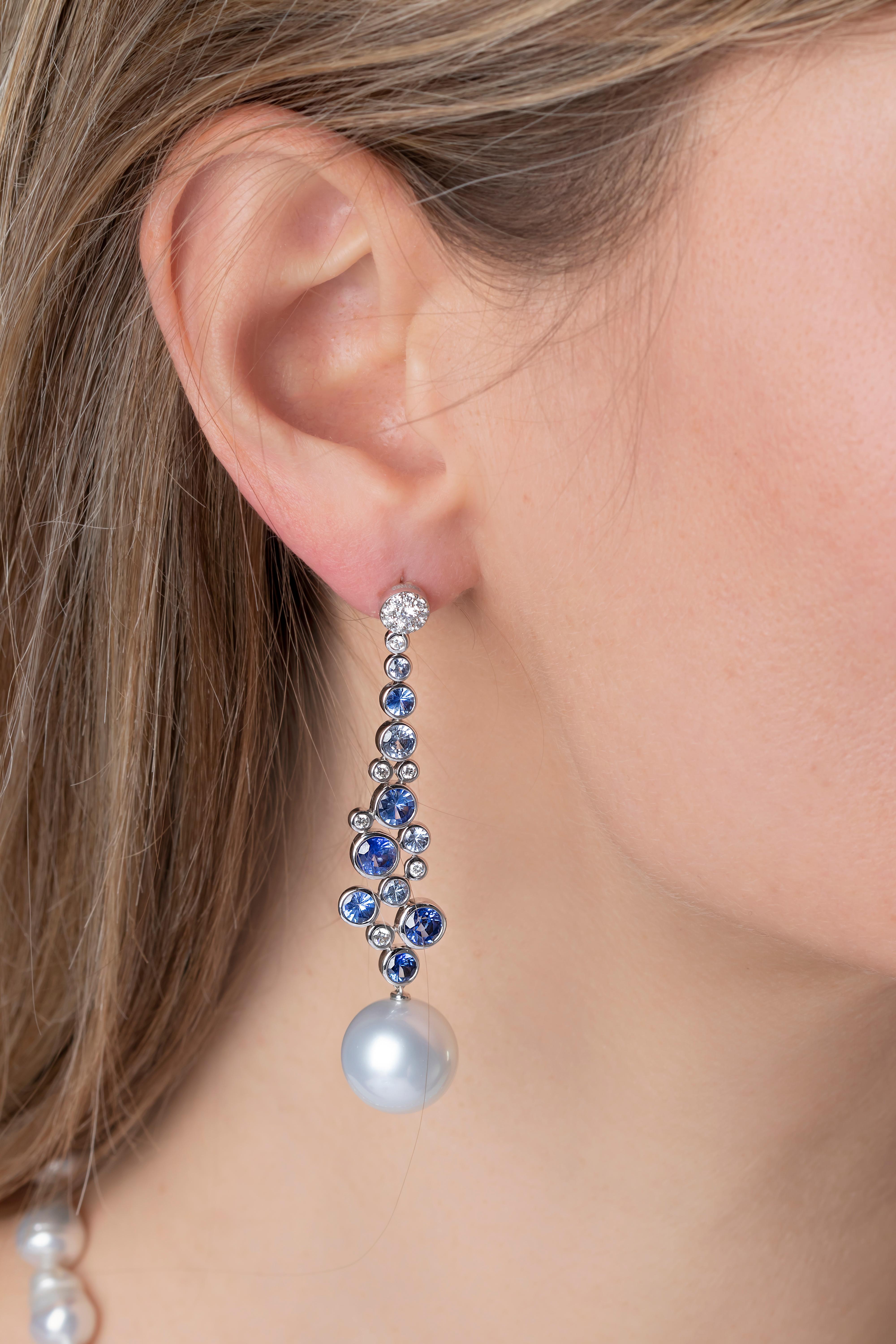 These striking earrings by Yoko London feature lustrous South Sea pearls beneath a scattering of sapphires and diamonds. These earrings have been masterfully engineered in our London atelier to move with their wearer, meaning they exude a constant
