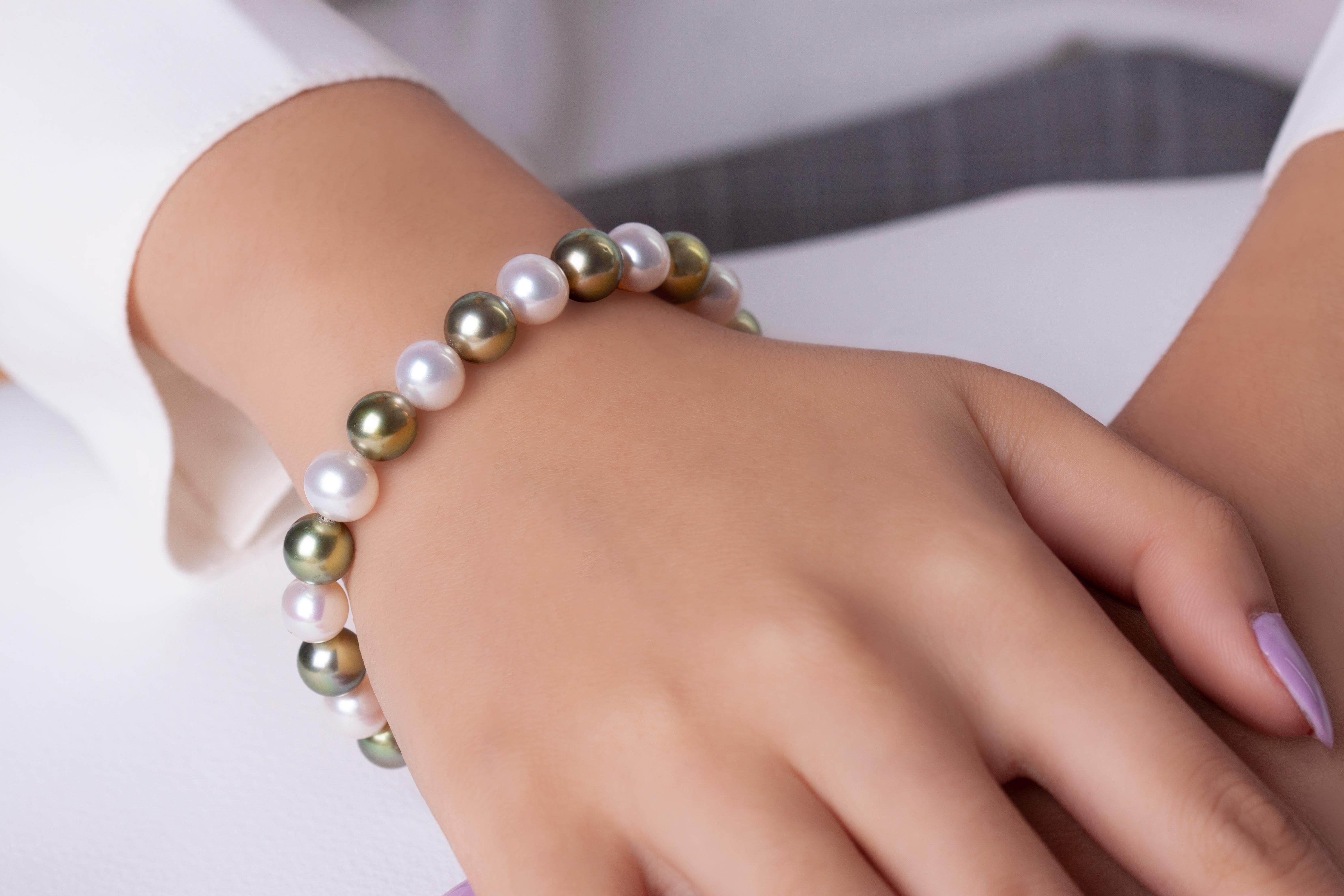 This unusual bracelet by Yoko London features white and Pistachio 
This unusual bracelet from Yoko London features a row of 9mm alternating white Freshwater and Pistachio-Coloured Tahitian Pearls secured on elastic to allow for maximum comfort. To
