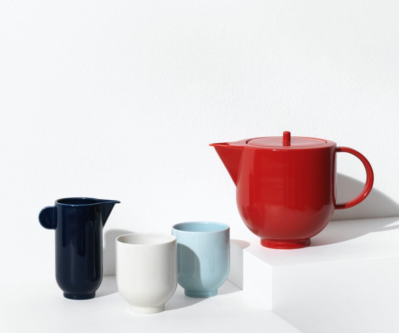 The YOKO mug is a significant and distinctive piece of tableware. Its simple, sculptural shape with a firm, sharp edges challenges the soft material of porcelain.

The mug is available in eggshell white and light blue. It contains 0,23L

YOKO is a