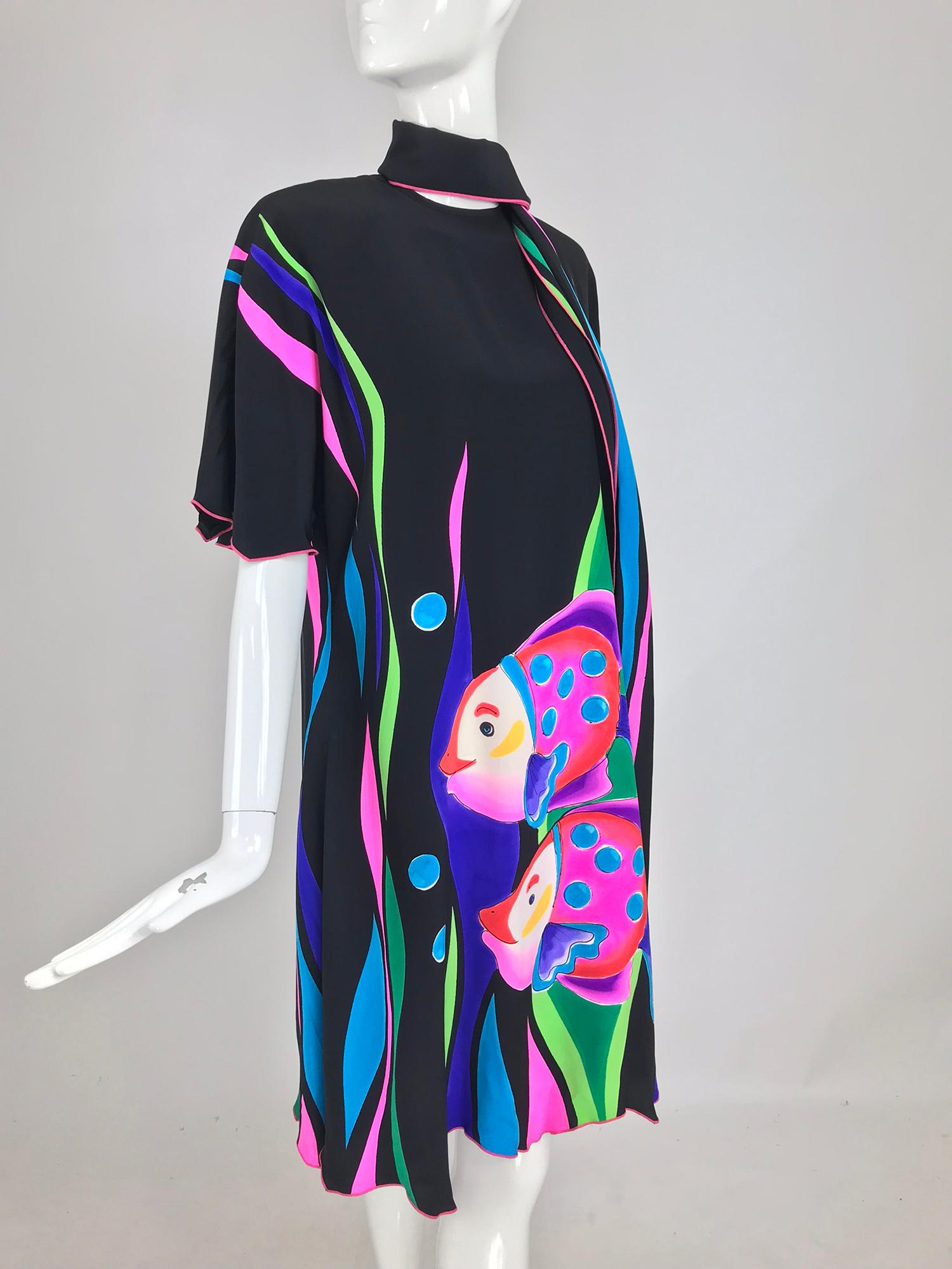 Yolanda Lorente Hand Painted Silk Dress with Fish. Black silk hand painted shift dress with a happy fish at the front and back in brilliant colours. Fluttery elbow length sleeves are finished in hot pink stitching. The full dress has a saw tooth hem