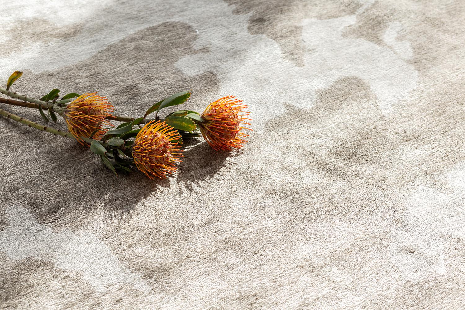 A Minimalist modern design rug in Yokai collection that will charm your stylish mind with its sophisticated vibe. Featuring the taupe and ivory shades, this stunning rug boasts its mysterious art form creating an illusion that gives edge to this