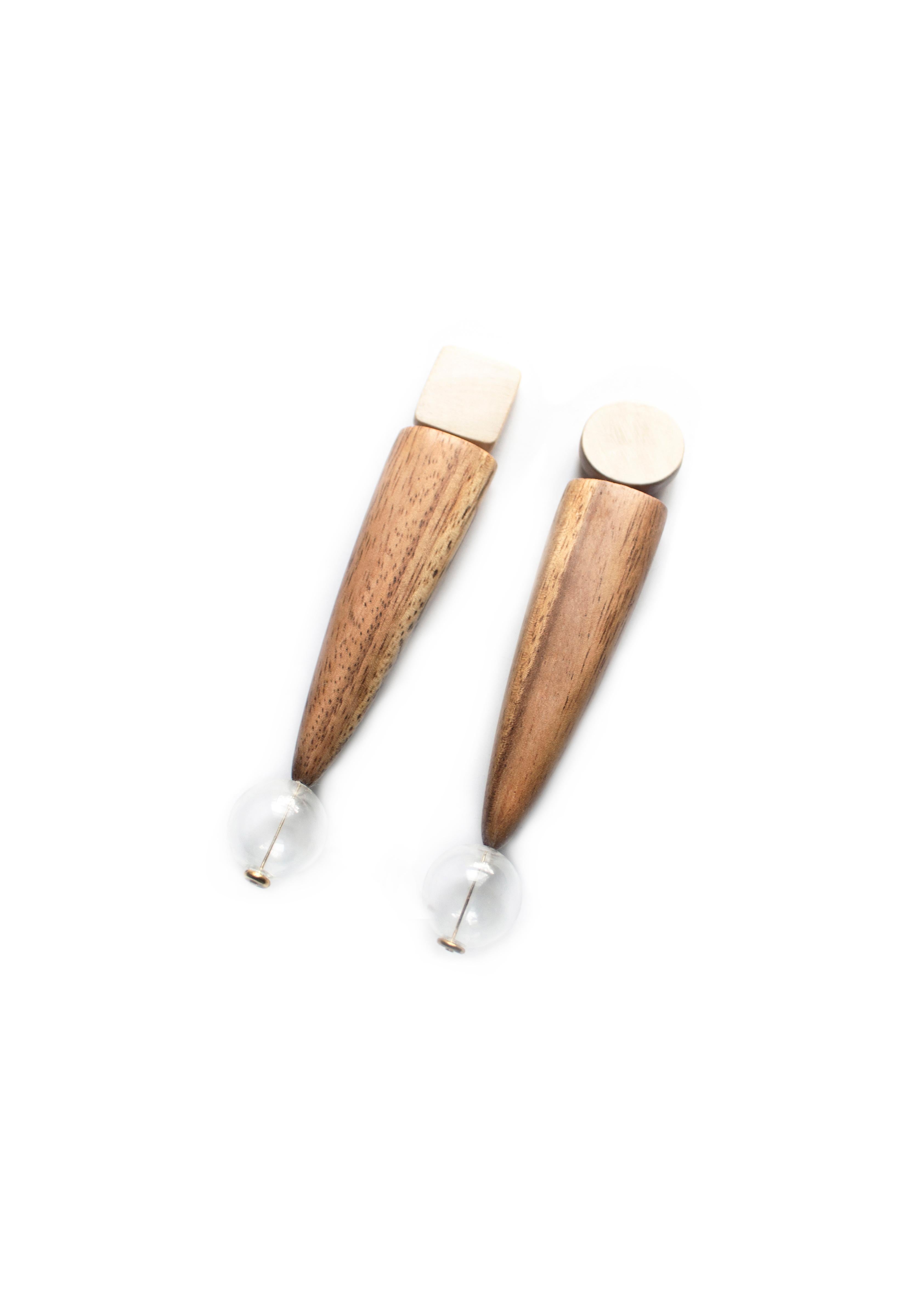 Large wood dangle mod earrings inspired by the mid-century surfboard aesthetic.  Hand carved reclaimed acacia with affixed spherical blown glass embellishment.  Hypoallergenic stainless steel posts. 

All Hola Luna pieces are handcrafted one-off