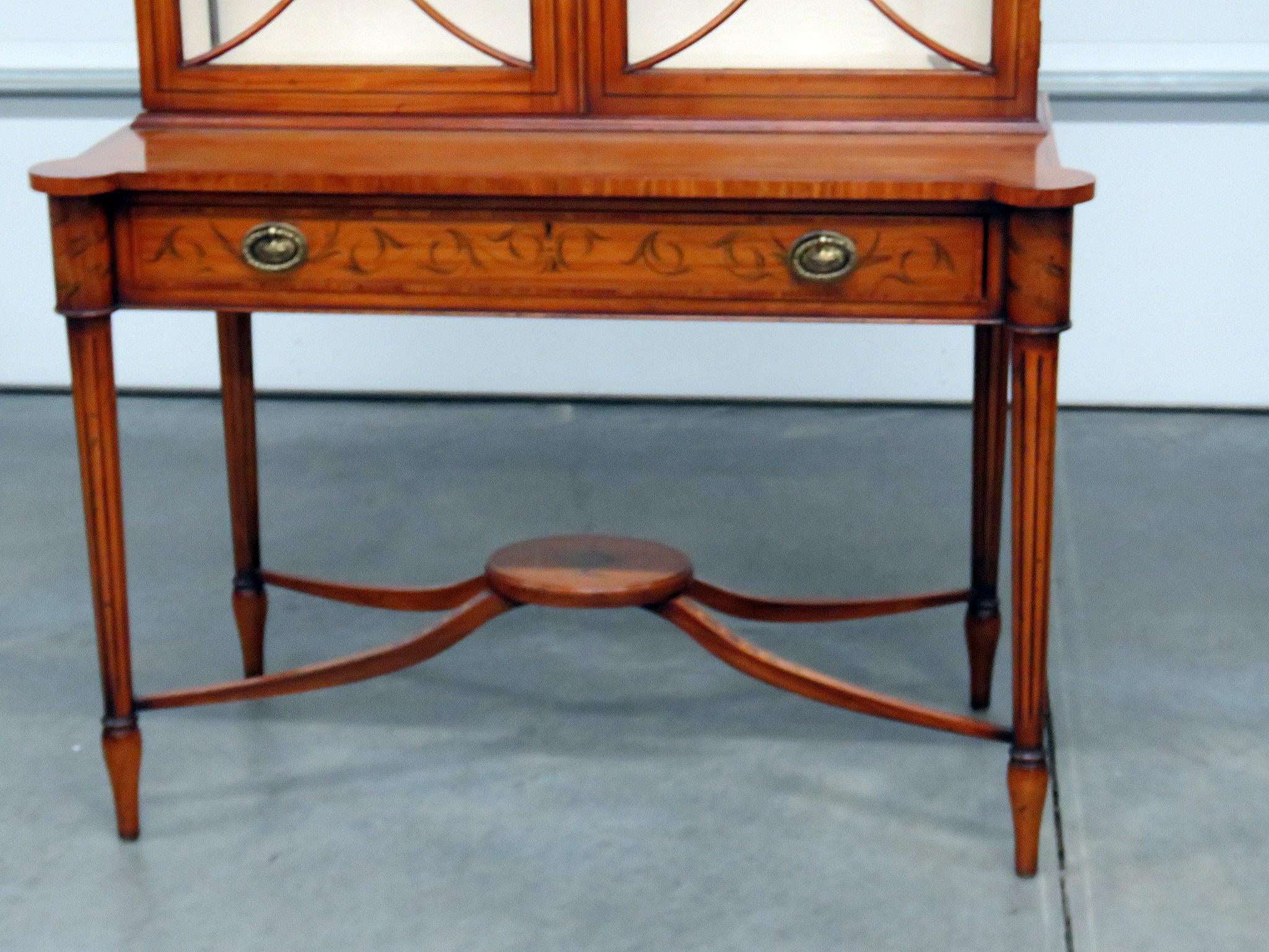 Yorkshire House Adams style china cabinet with 2 doors containing 2 shelves over 1 drawer.