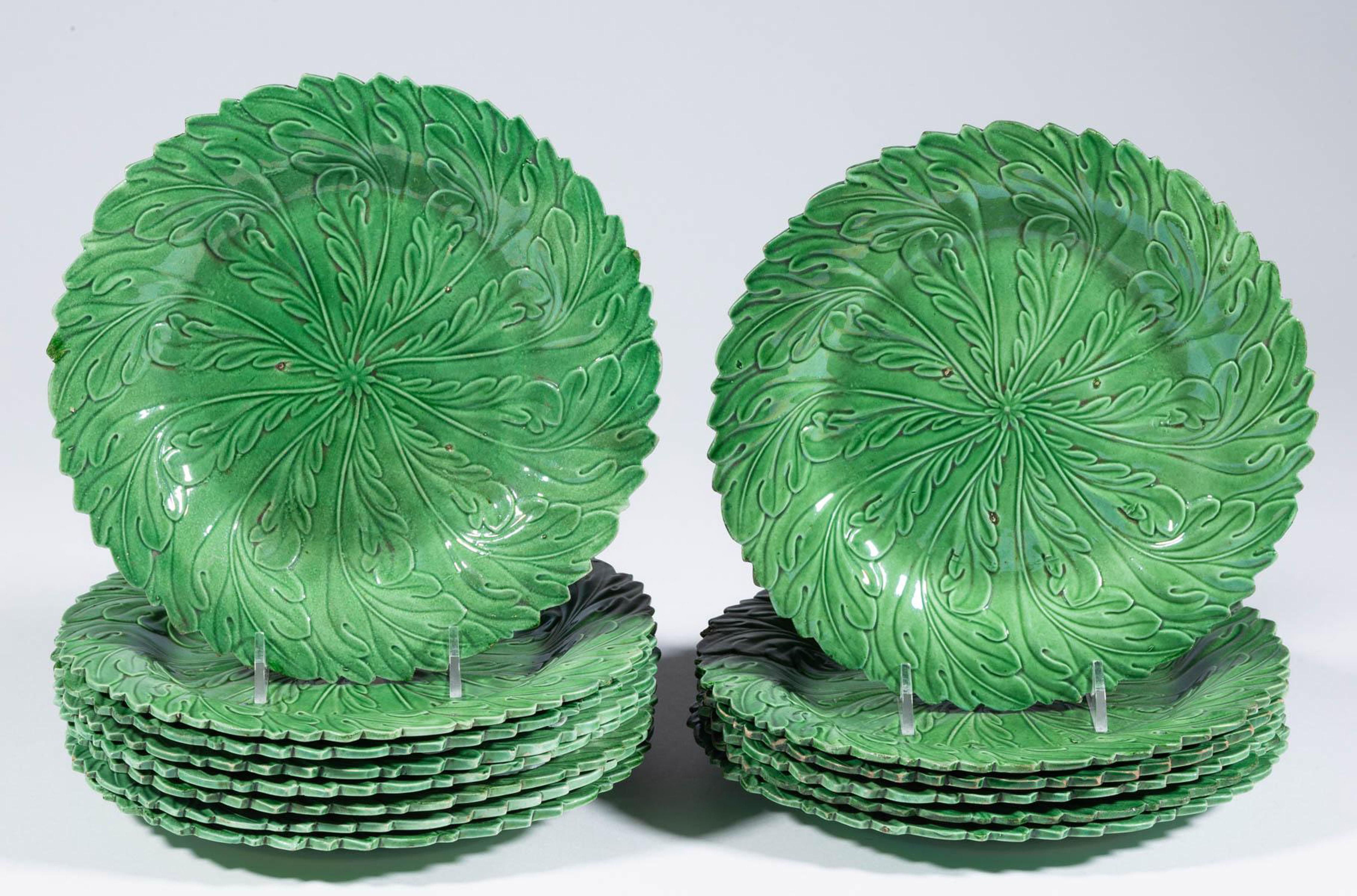 Yorkshire pottery green-ground set of fourteen plates,
Brameld,
circa 1820
(Ref: NY9374-PIIX)

The plates are molded in the form of oak leaves with shaped edges.

While unmarked, this type of ware was often made at Brameld,