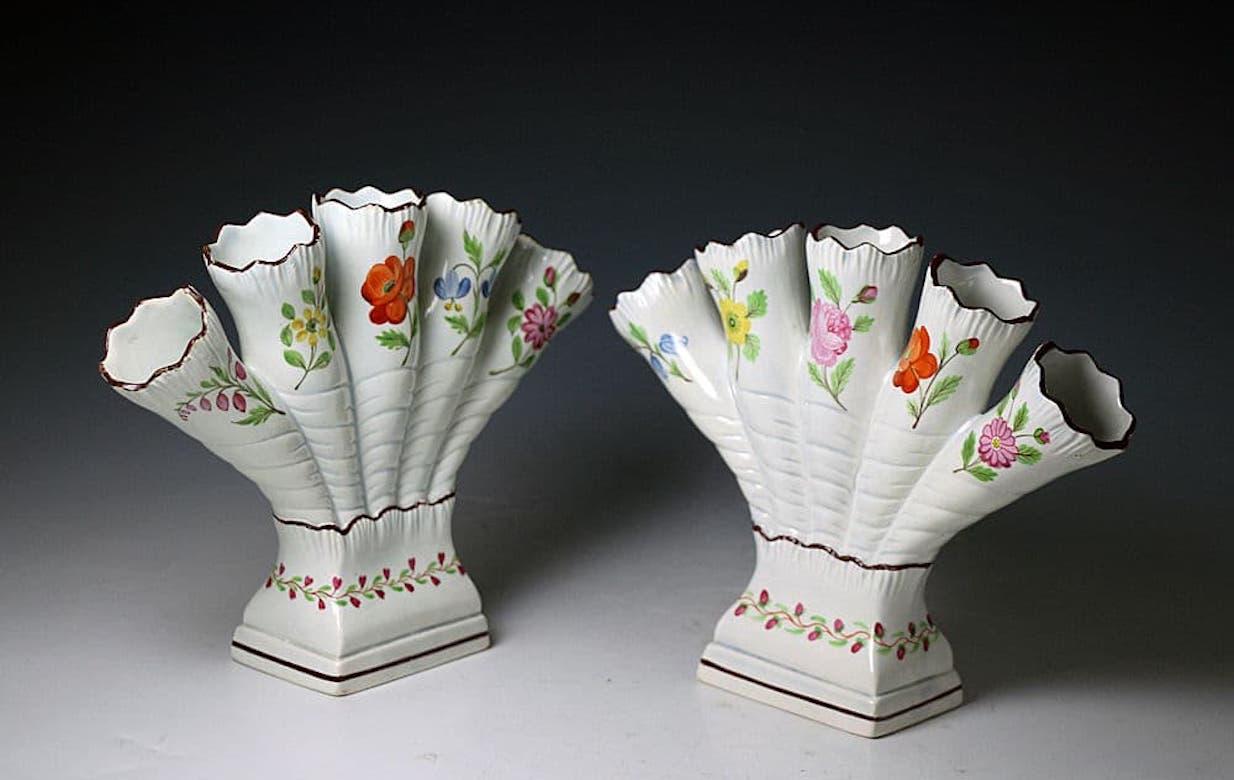 A very fine quality pair of pearl ware glazed pottery quintel vases expertly hand decorated with various flowers. The five fingers have a shell edge, a highly popular technique at the turn of the 18th century. Made by the Don Pottery Yorkshire