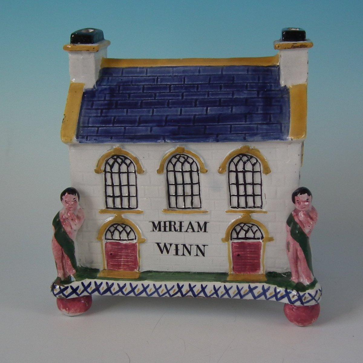 Staffordshire Pottery Yorkshire money box which features Mexborough Chapel - with the box owners name, 'MIRIAM WINN', printed on the front. Flanked by two figures standing either side of the front doors, stood on a rectangular footed base. Coin slot