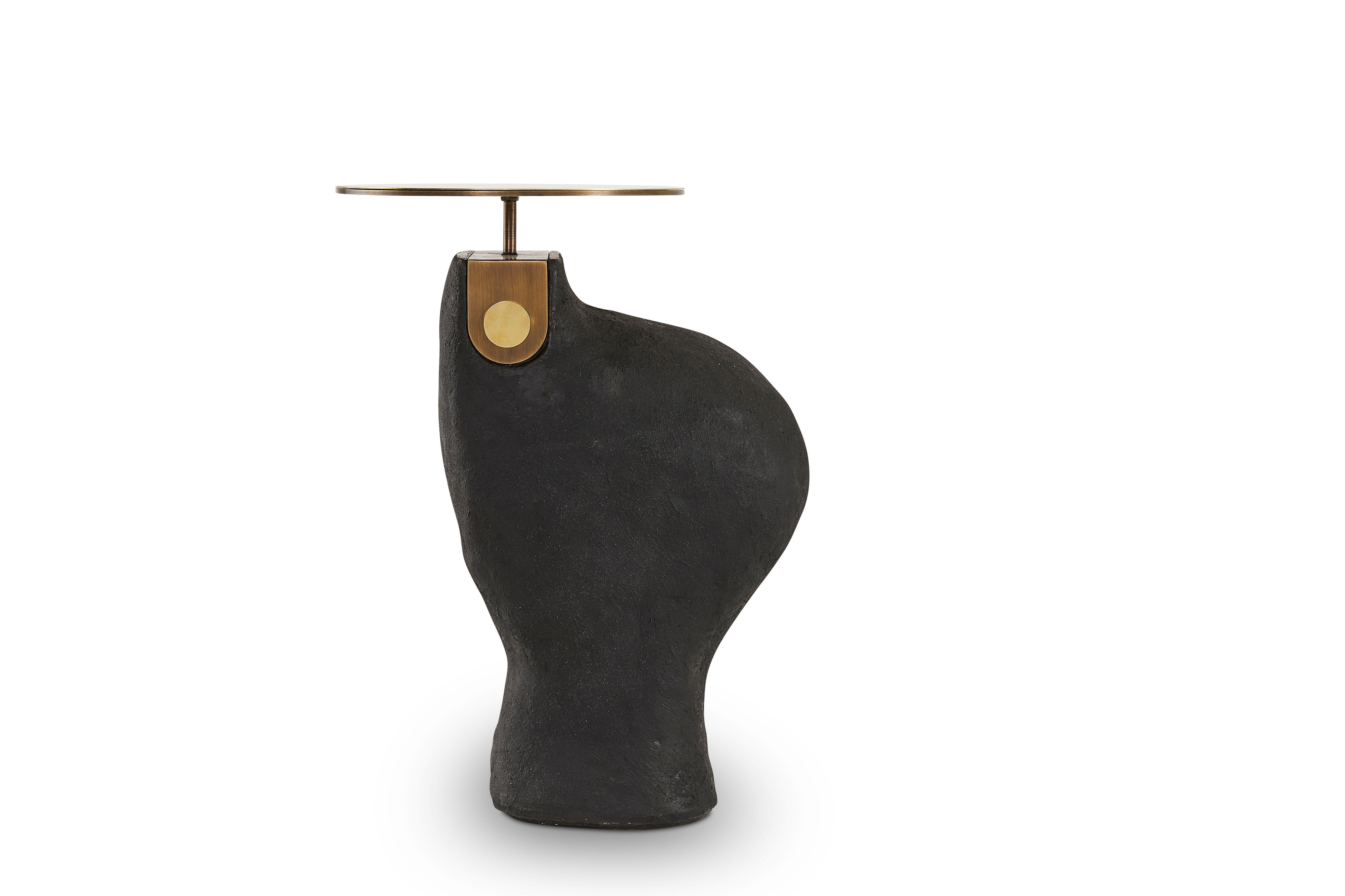 Yoruba 3 Side Table by Egg Designs
Dimensions: 52 L X 33 D X 43.5 H cm 
Materials: Composite Casting, Solid Brass, Bronze Coated Steel

Founded by South Africans and life partners, Greg and Roche Dry - Egg is a unique perspective in contemporary