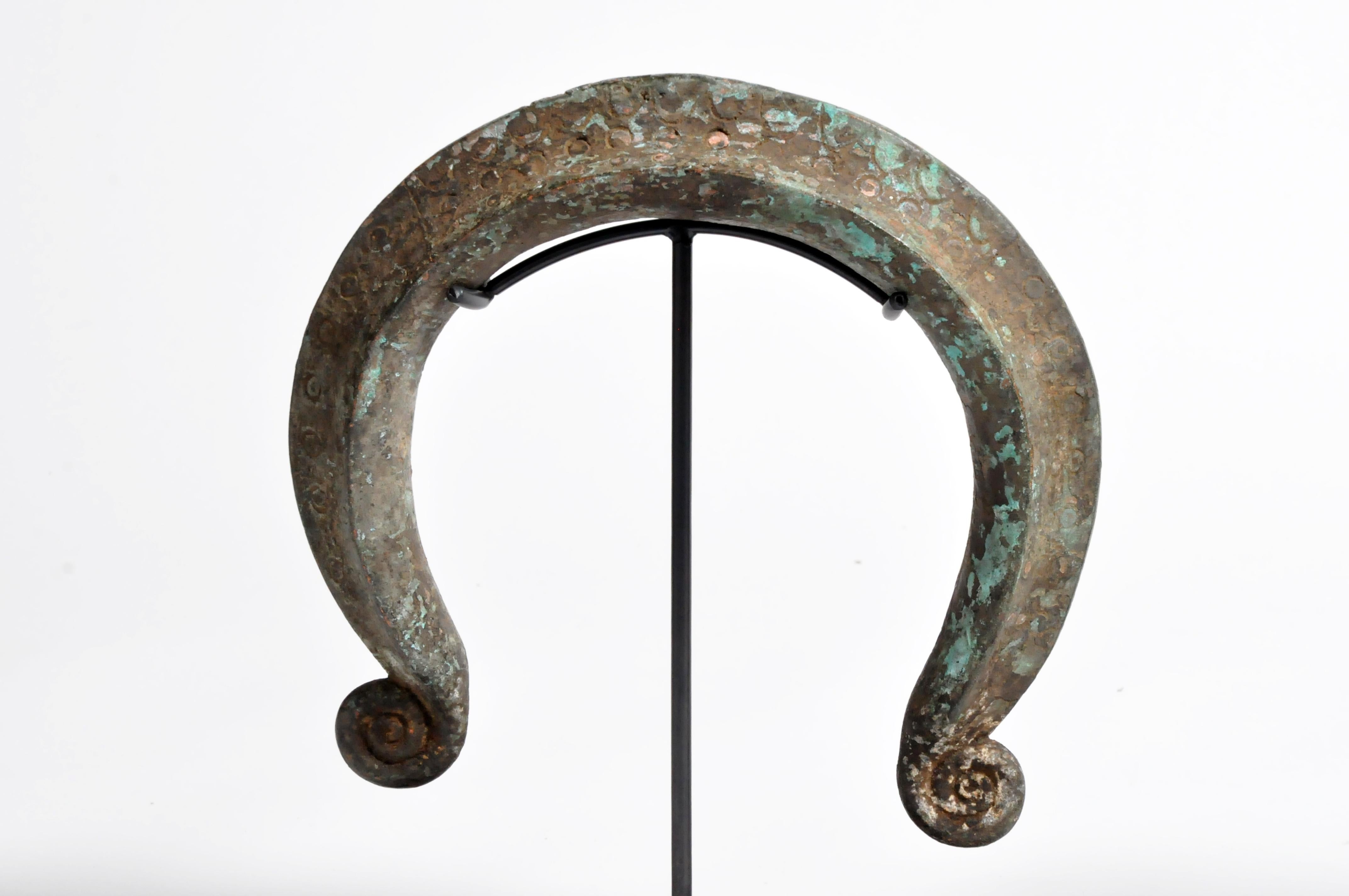 This Yoruba neck ring was made from cast bronze using the lost wax method. This piece features a rich patina and is mounted on a contemporary custom metal Stand. The Yoruba are found principally in Nigeria and Benin, 20th century.